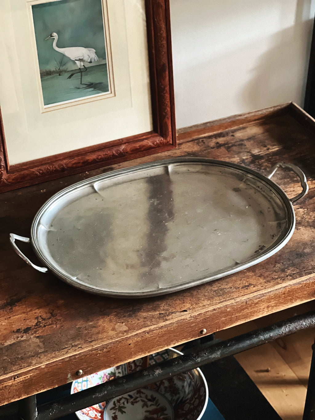 empty pewter tray showing surface and patina