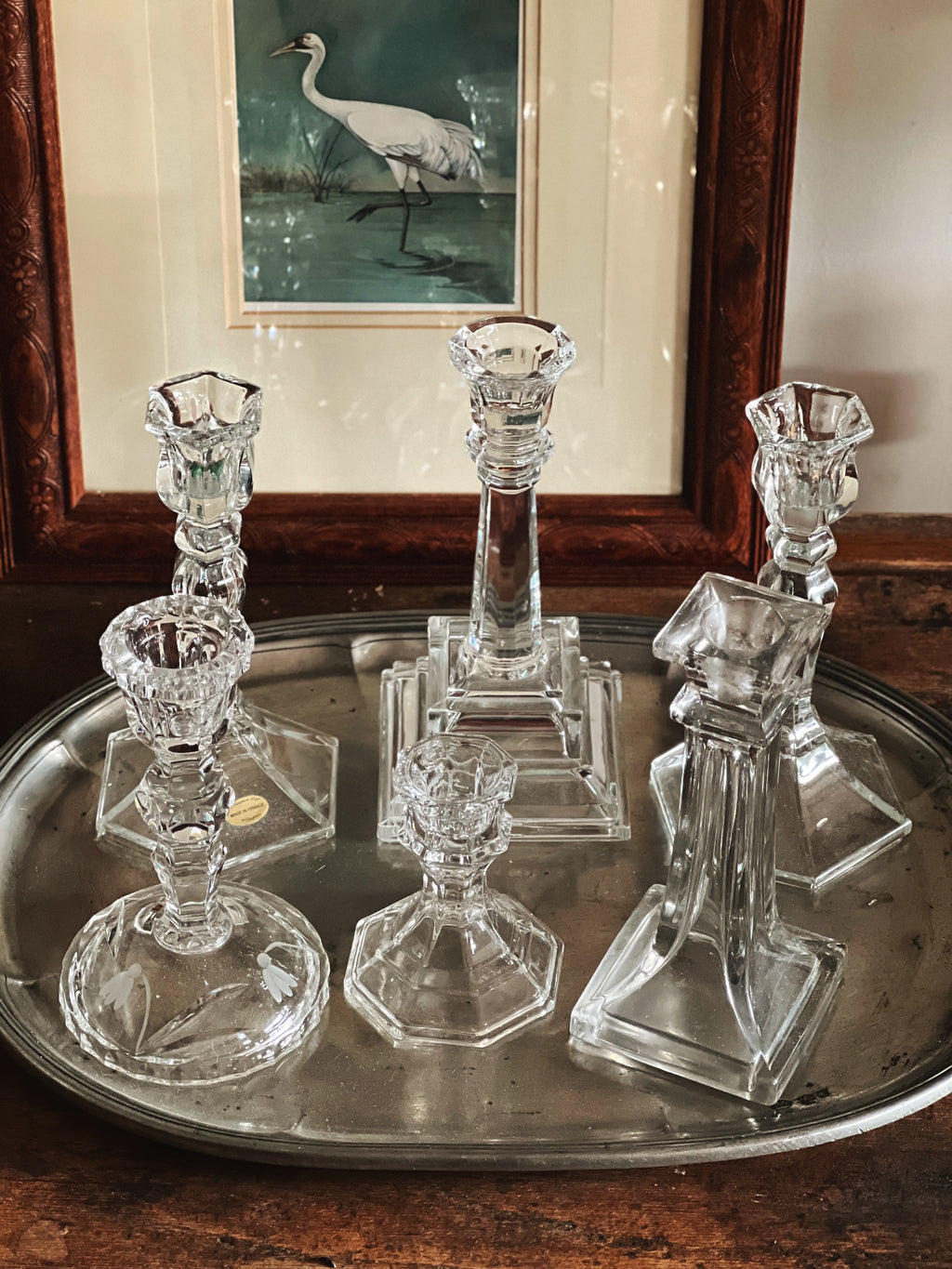 candlelight arrangement with varying candlestick heights on tray