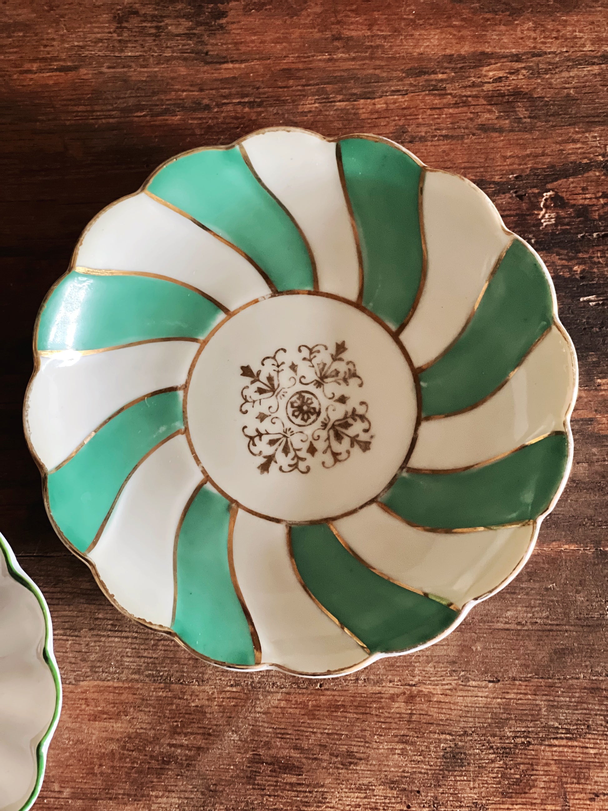 close up of hand painted stripe design on small plate