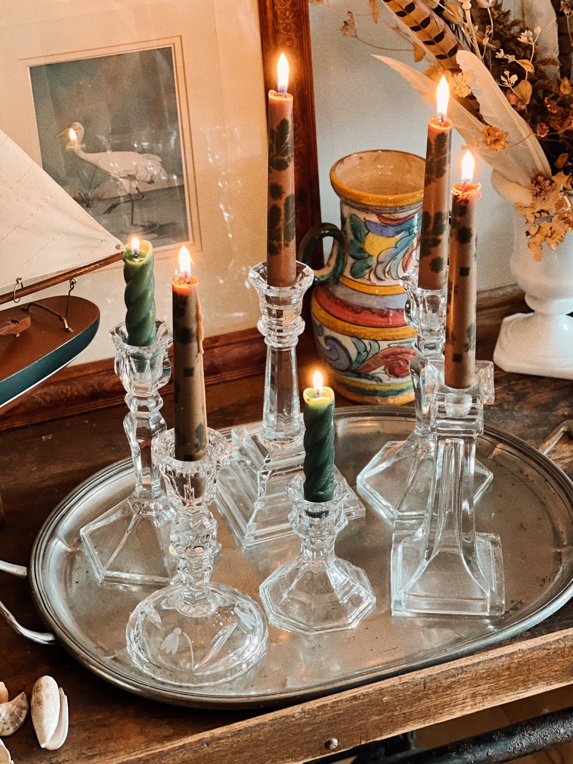 collected mix of glass and crystal taper holders styled together