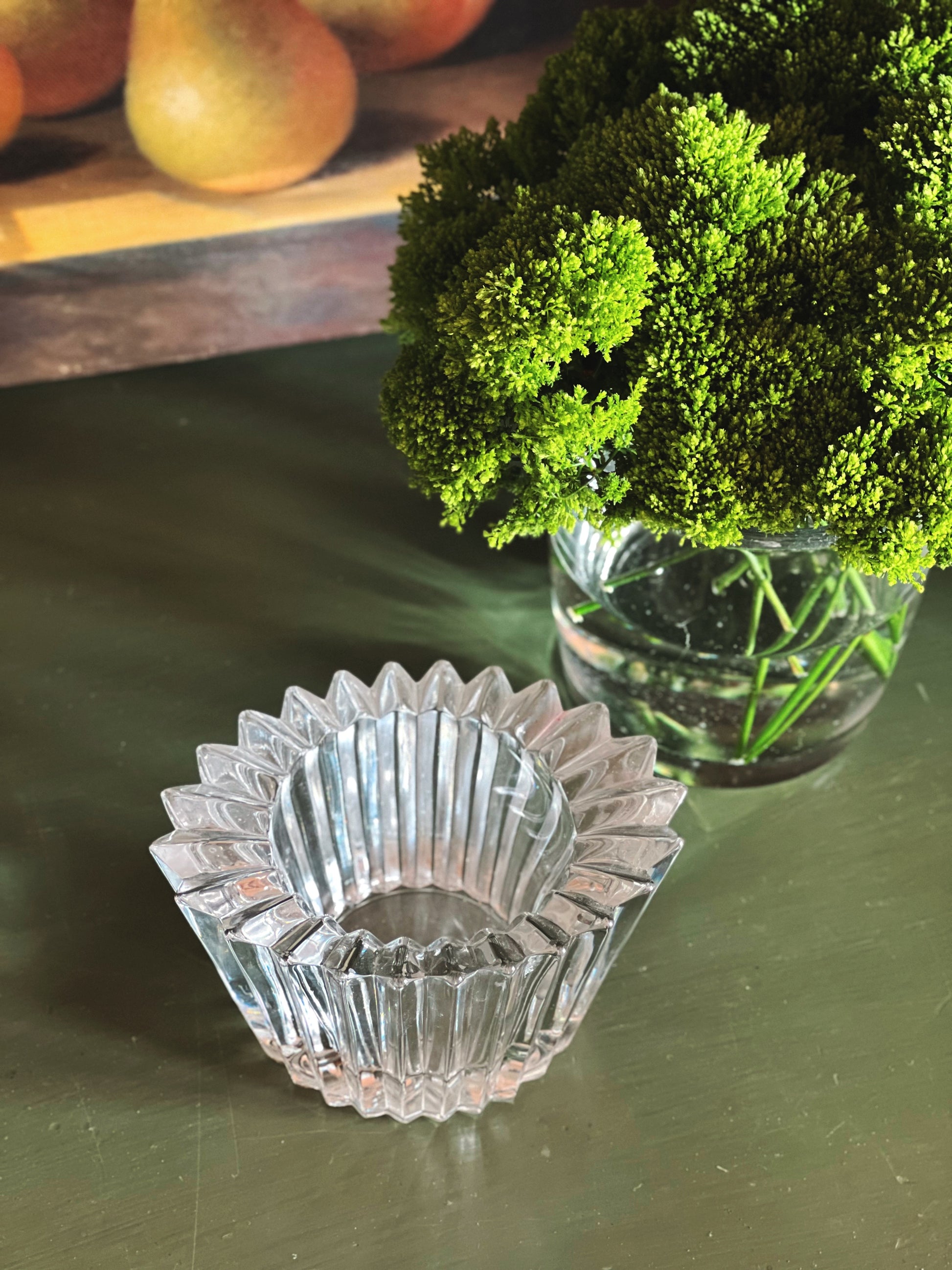 Overhead view of vintage Studio Nova crystal votive holder with scalloped detail