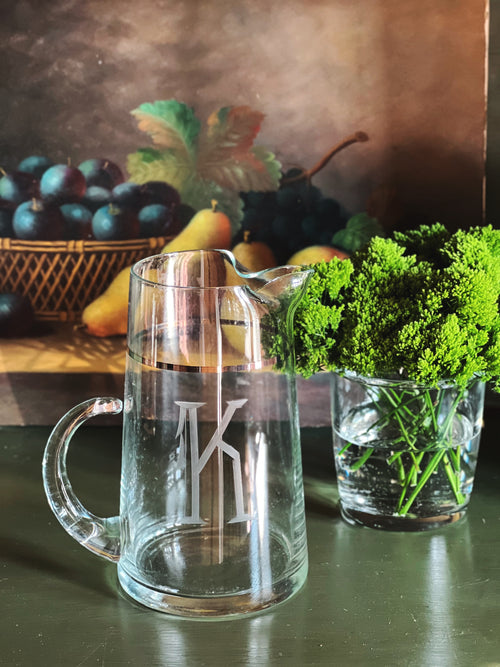 Small vintage glass pitcher with etched monogram K and silver accent band