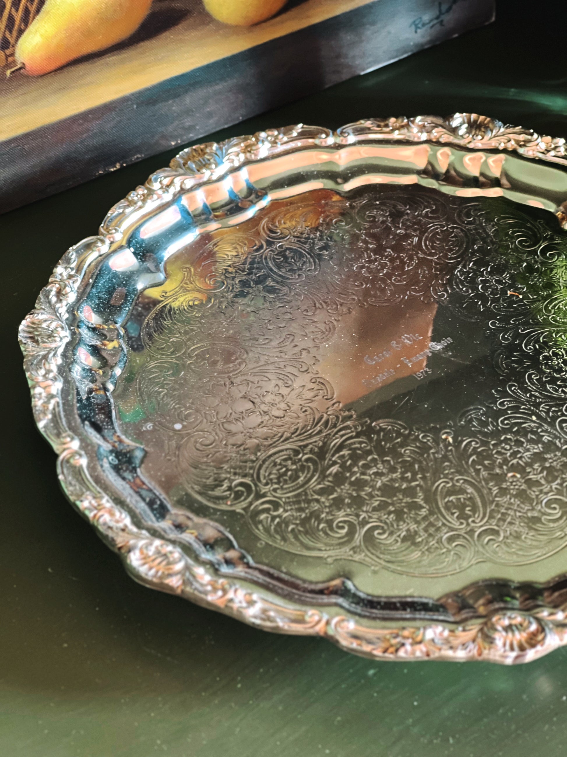 Detailed view of ornate scalloped border on vintage Poole silverplate tray