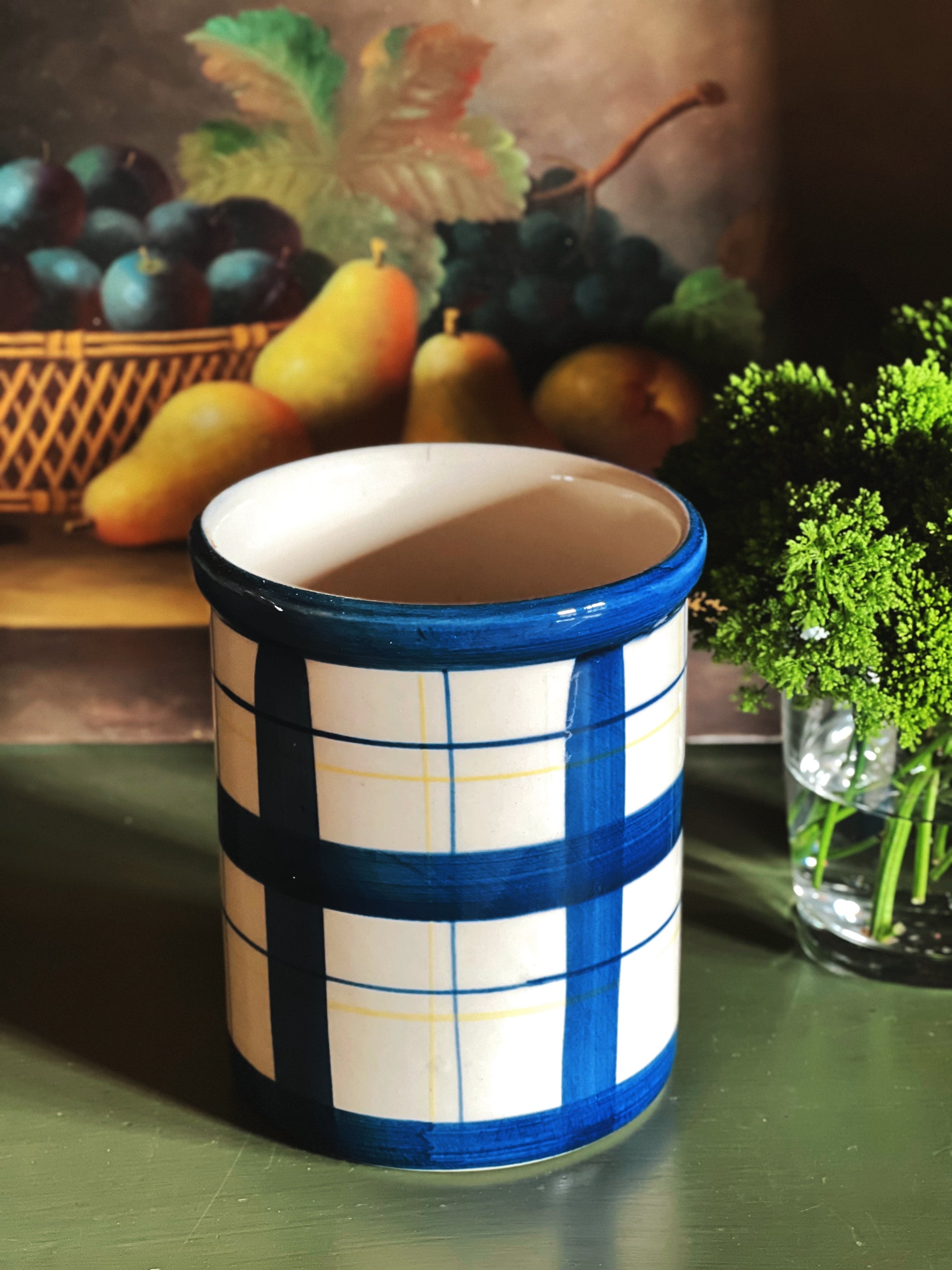 Blue plaid ceramic crock with glossy glaze and cylindrical shape
