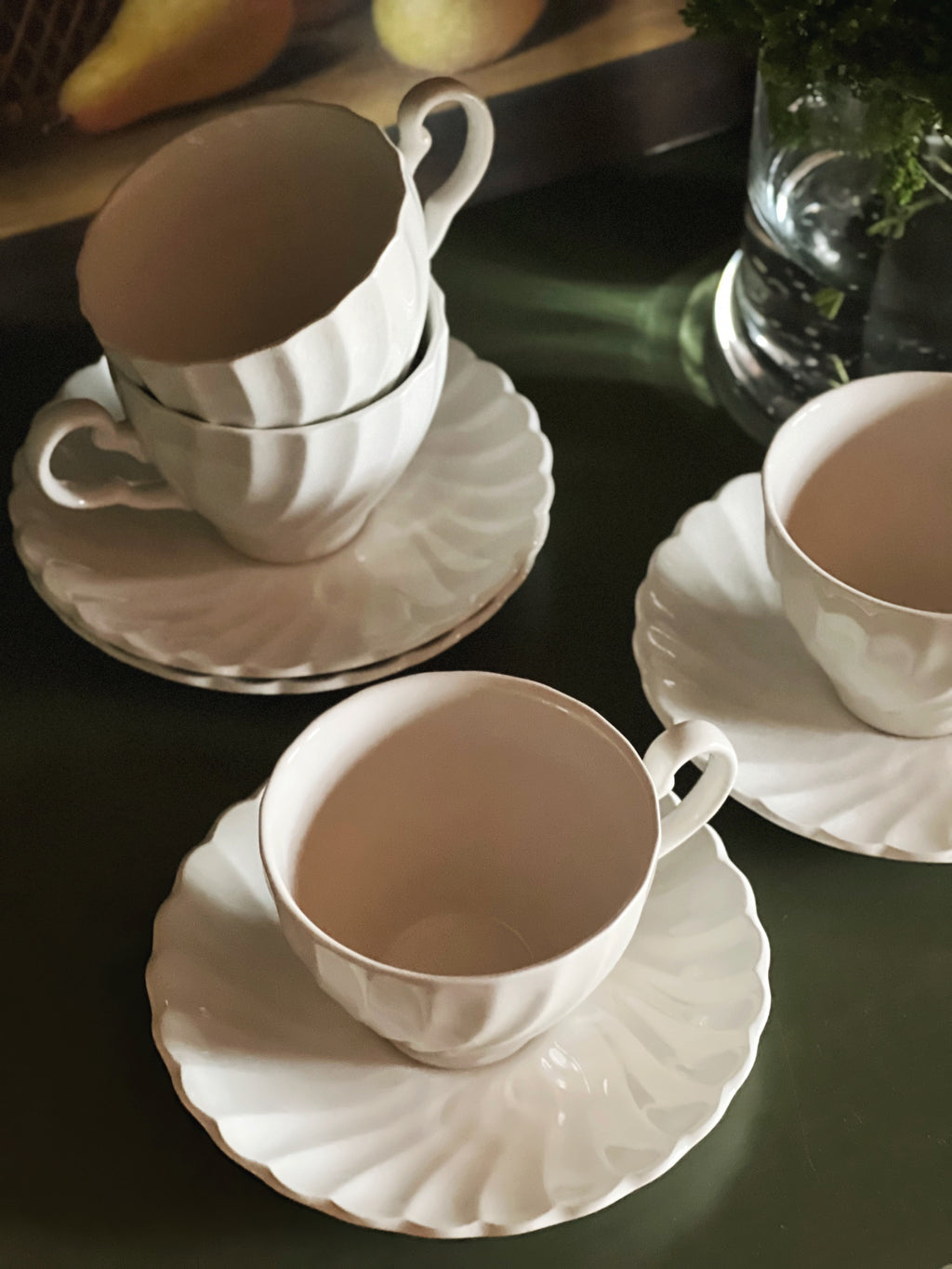 Collected Johnson Brothers Regency teacups and saucers with sculptural fluted detailing