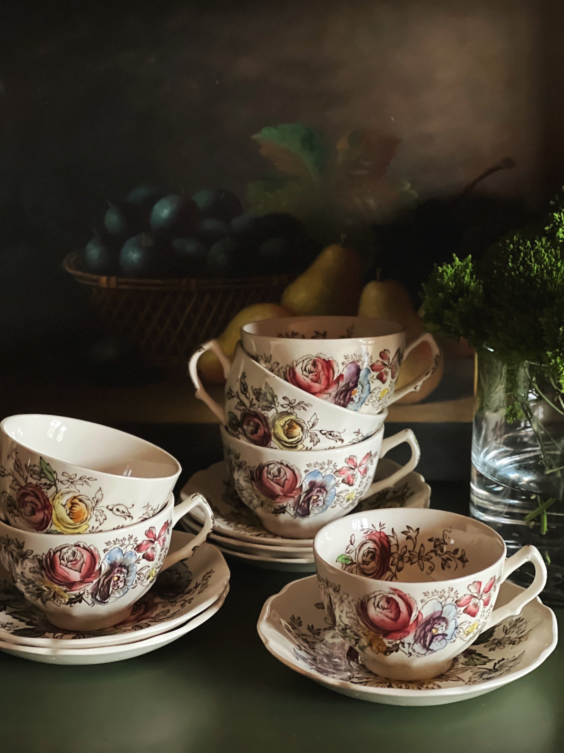 Stacked vintage JOHNSON BROTHERS Sheraton teacups and saucers with floral English ironstone pattern
