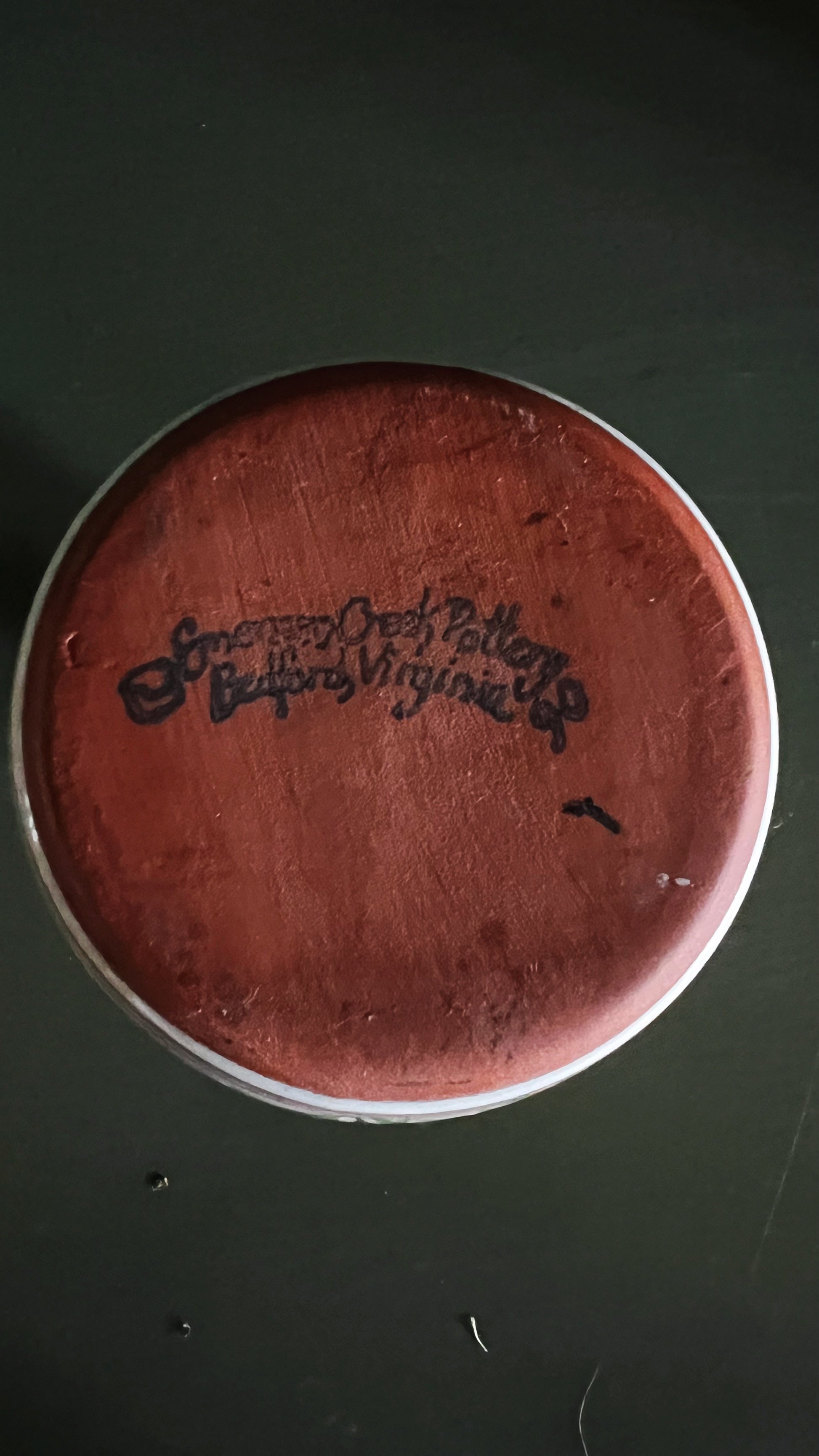 Emerson Creek Pottery maker's mark on the underside of a red ware vase