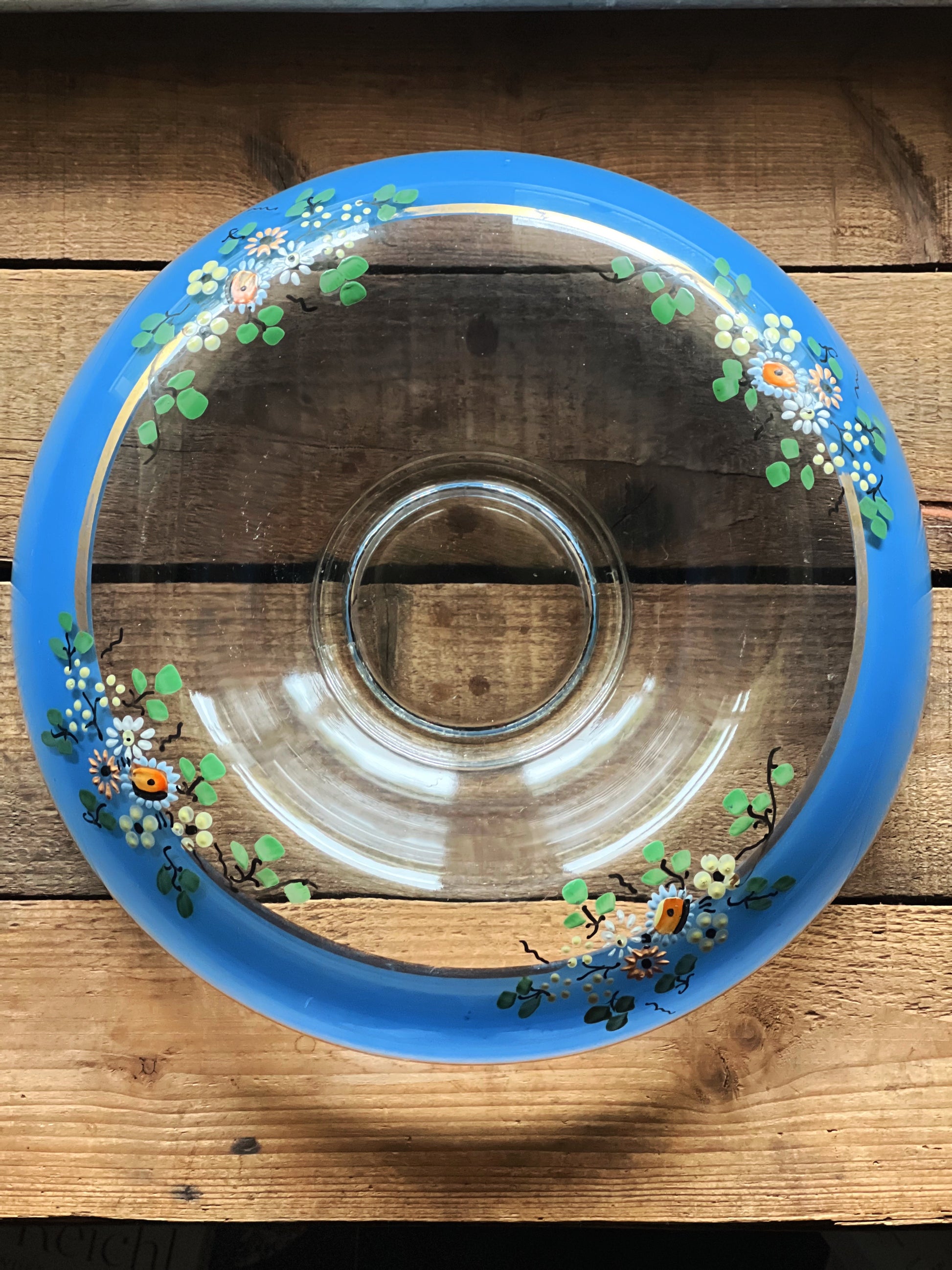 Overhead view of an Indiana Glass hand painted cobalt blue floral console bowl