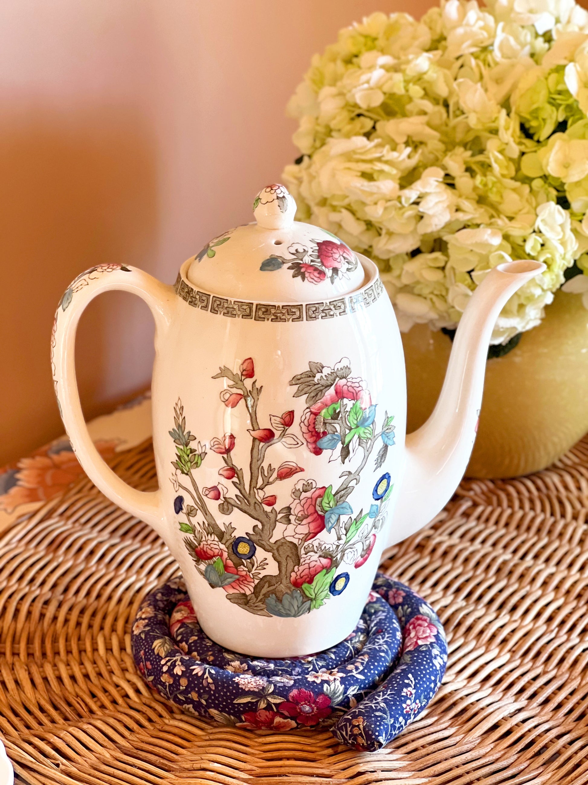 Vintage Johnson Brothers Indian Tree coffee pot styled beside hydrangeas on woven tray