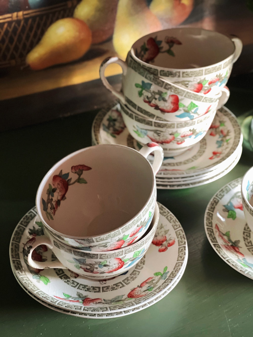 overhead view of stacked Johnson Brothers teacups and saucers
