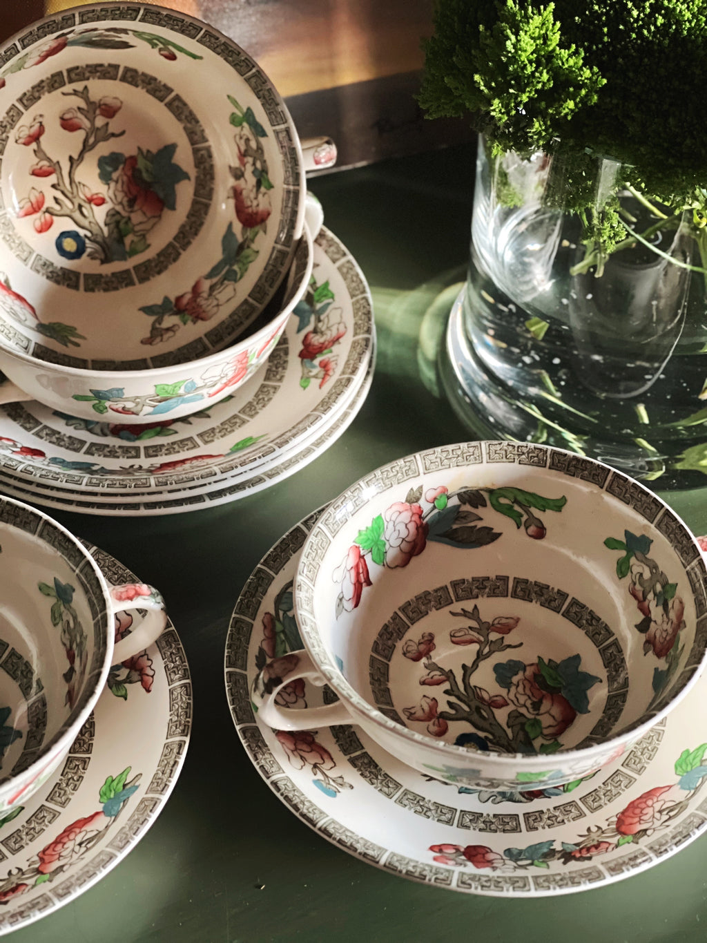 Overhead view of vintage Indian Tree handled soup bowls and saucers