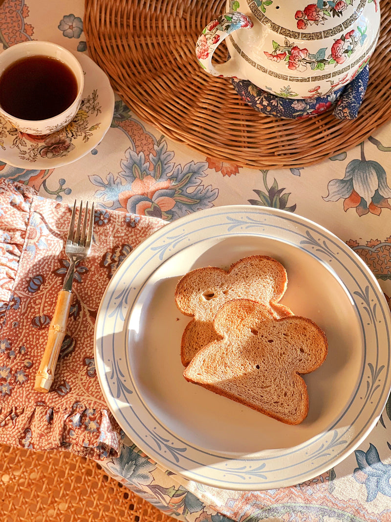 Vintage Japanese Blue Leaf stoneware dinner plate styled with toast and coffee in warm morning light
