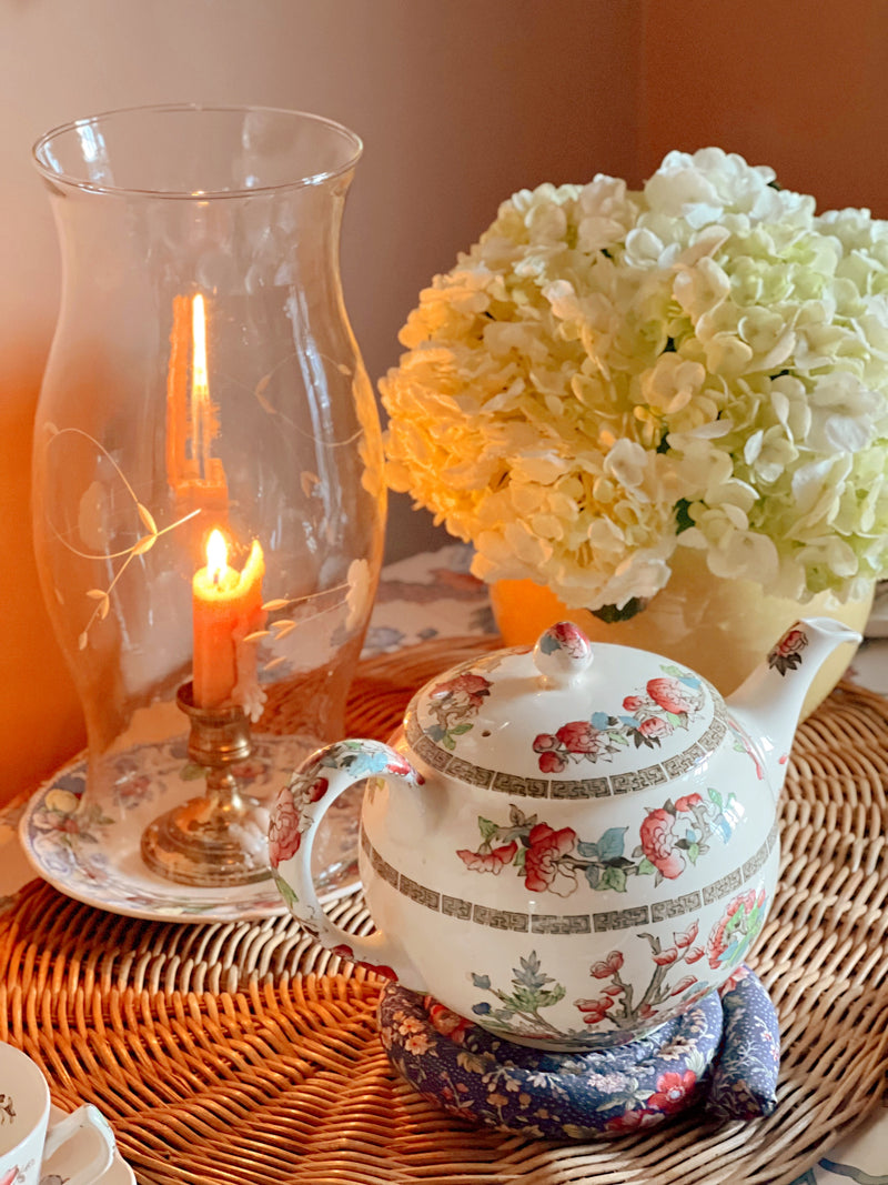 Vintage Johnson Brothers Indian Tree tea pot styled beside candlelight and hydrangeas