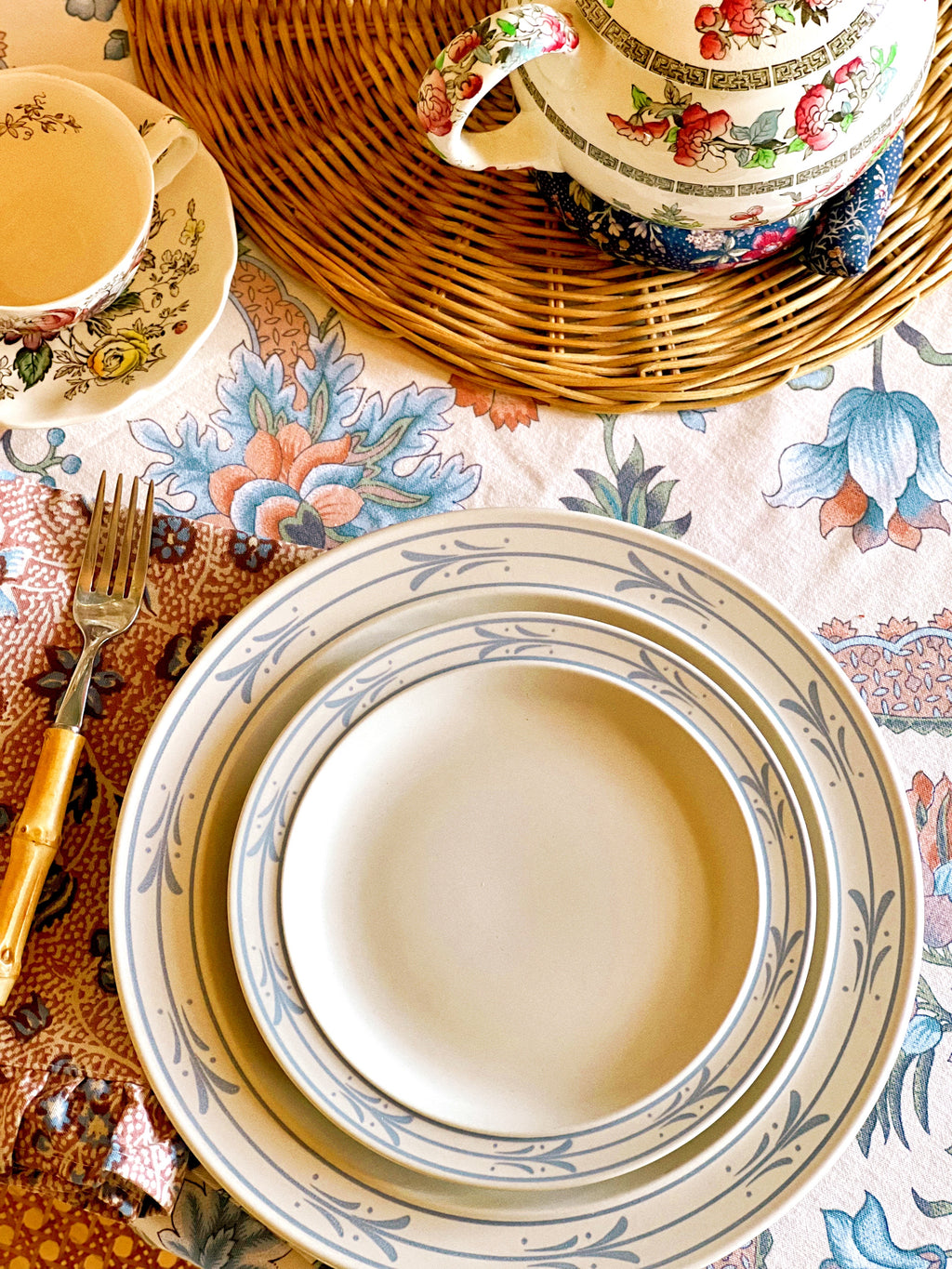 overhead view of a stoneware salad plate that is stacked on top of a matching dinner plate