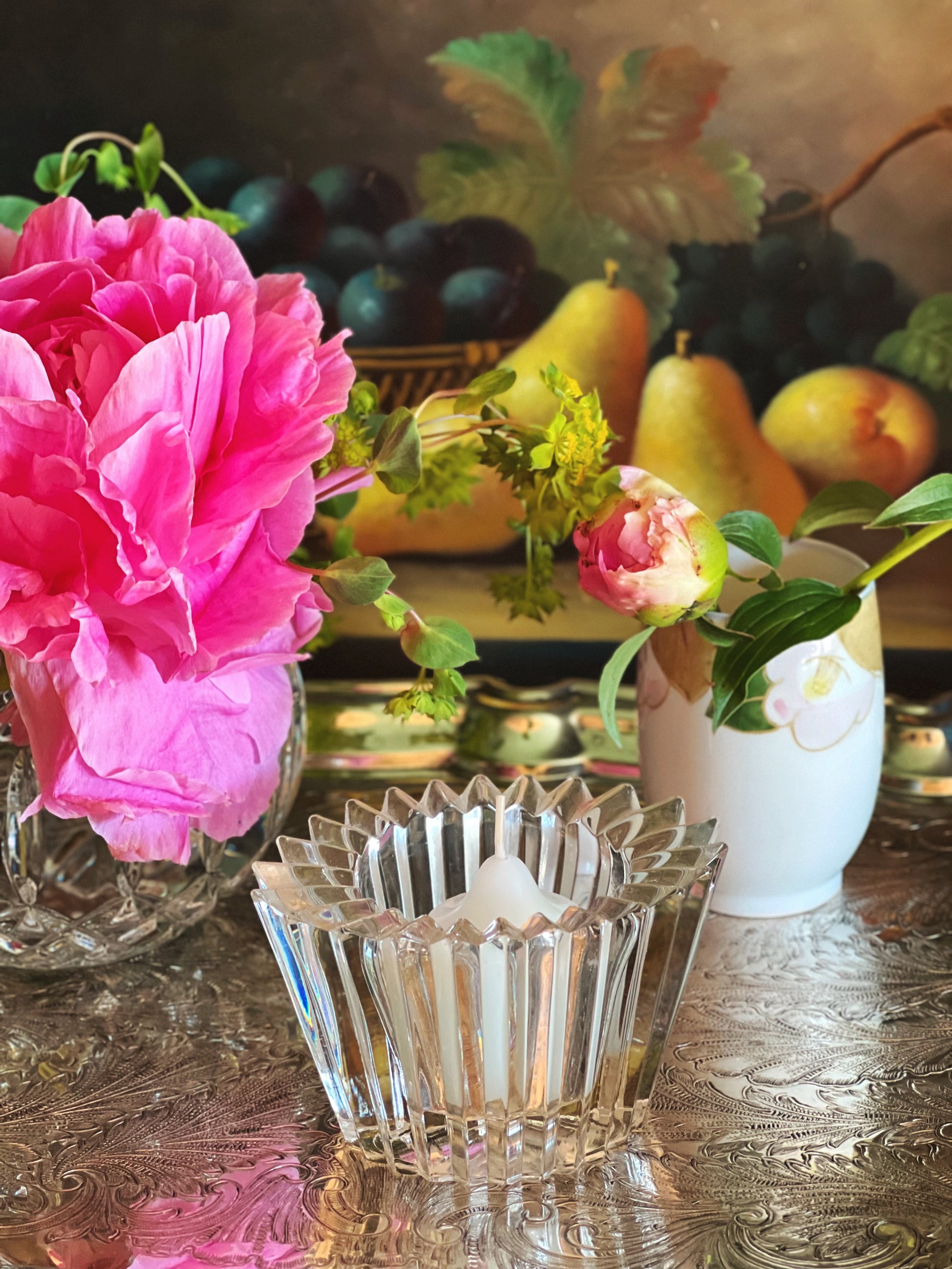 Scalloped vintage crystal candleholder styled with peonies for gathered entertaining