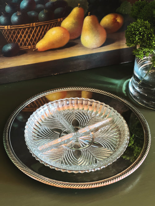 Vintage Wm Rogers silverplate tray with divided cut glass relish dish styled with pears and greenery on a dark wood surface