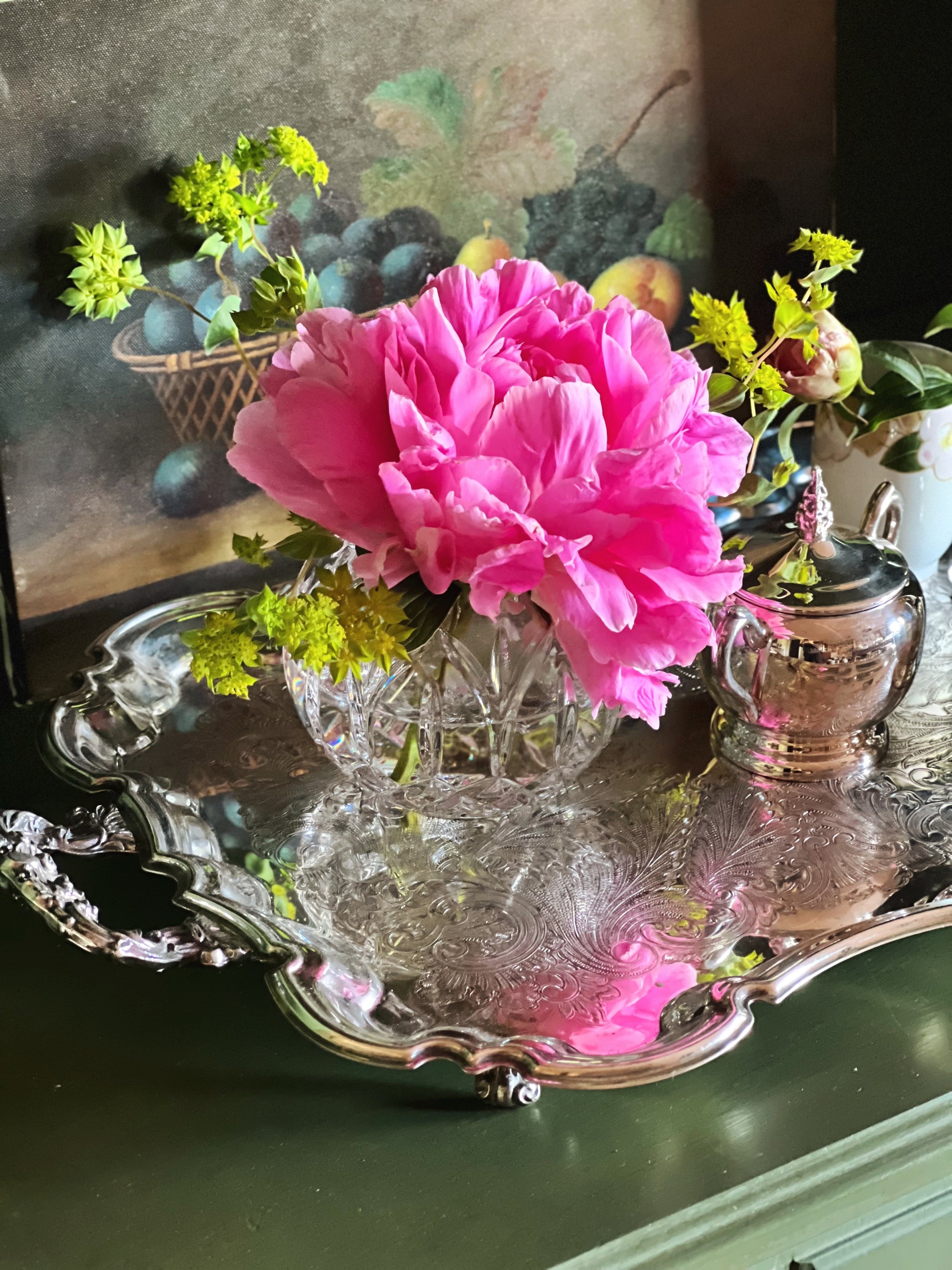 Large vintage Leonard silverplate butler’s tray with pink peonies reflected in the ornate engraved surface