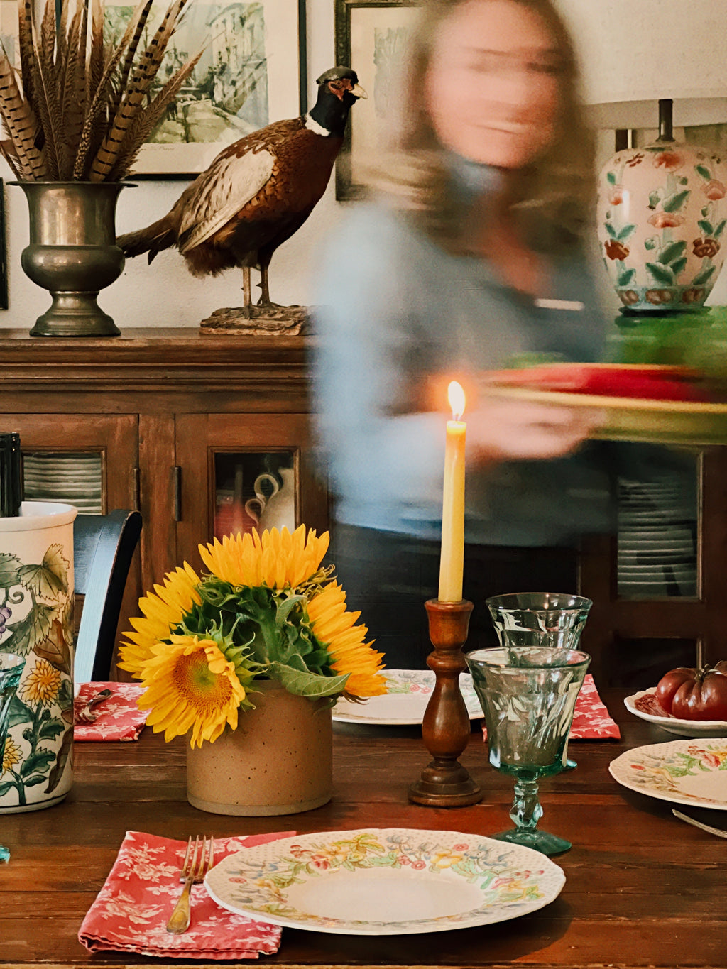 Dining table with floral arrangement, candle, and decorative items with Fostoria Jamestown Green wine glasses