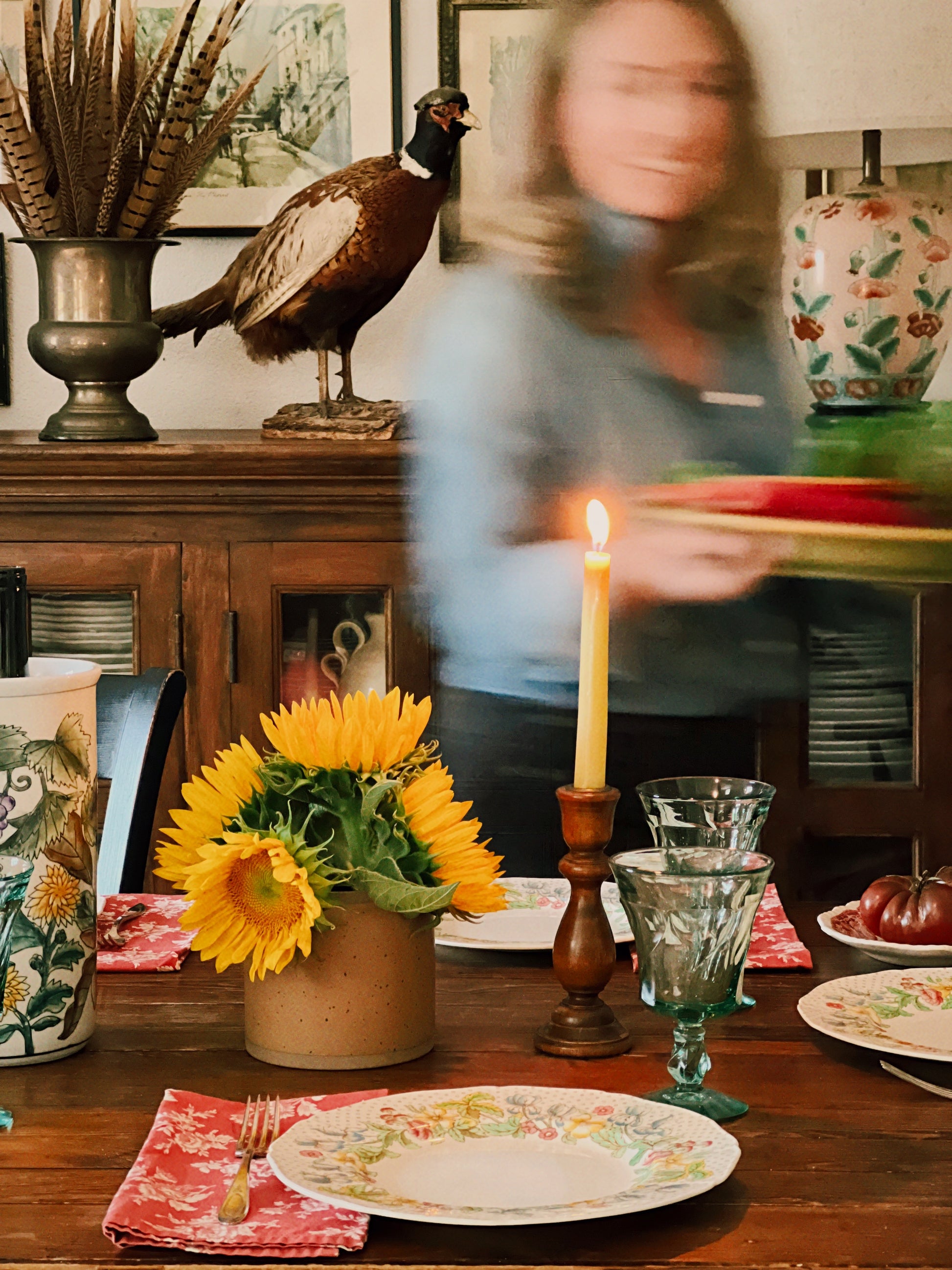 Dining table with floral arrangement, candle, and decorative items with Fostoria Jamestown Green wine glasses