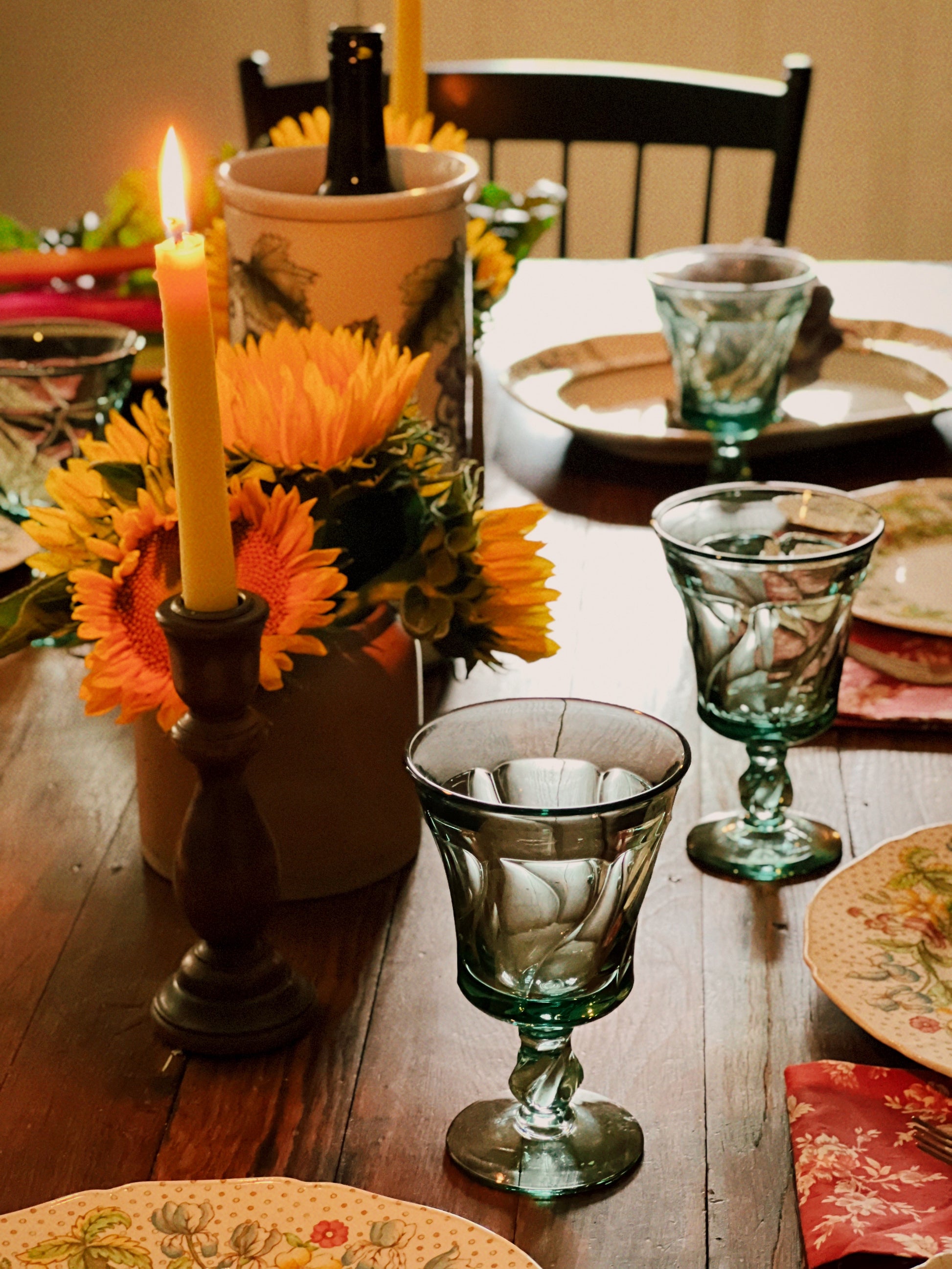 Fostoria Jamestown Green wine glass on a table set for a meal