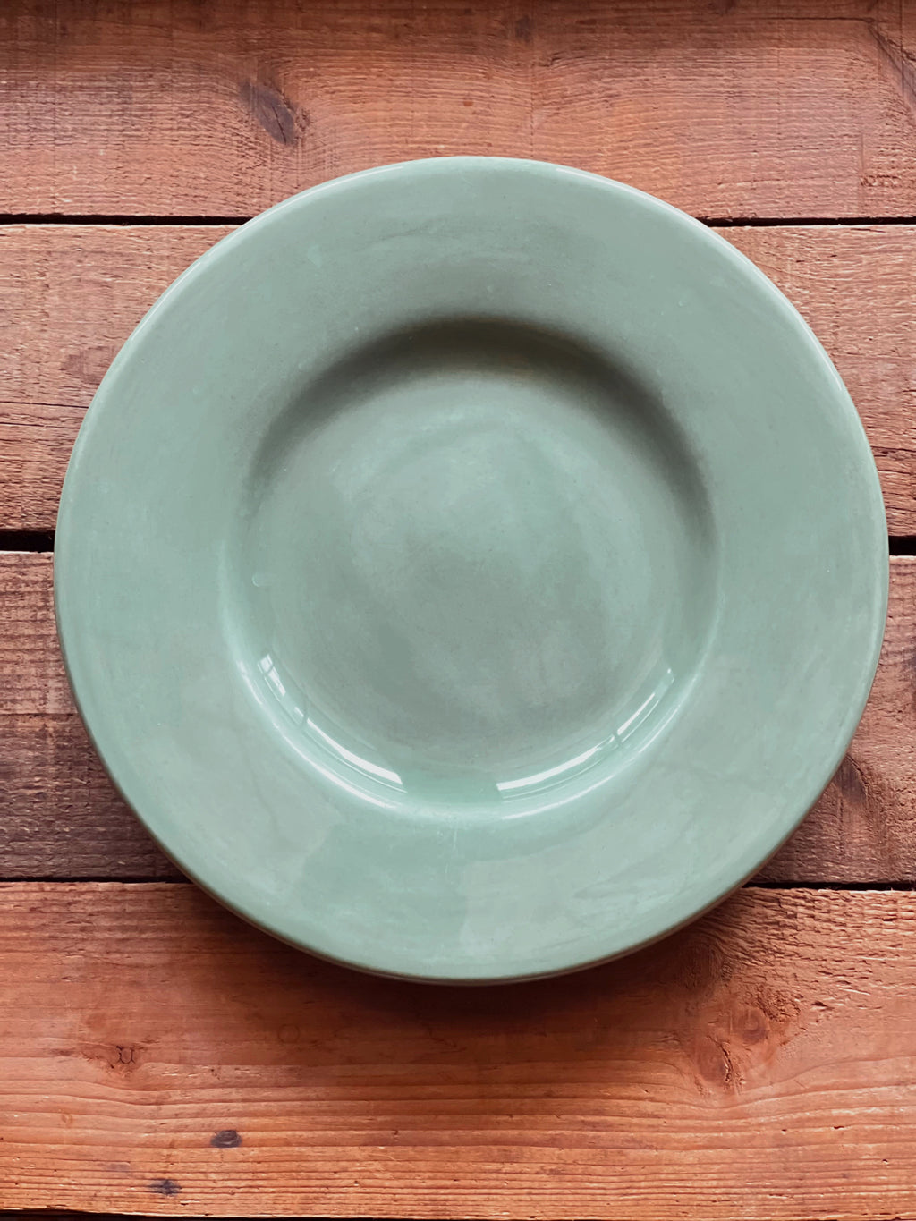 Overhead view of a Pottery Barn Sausalito Sage Green salad plate