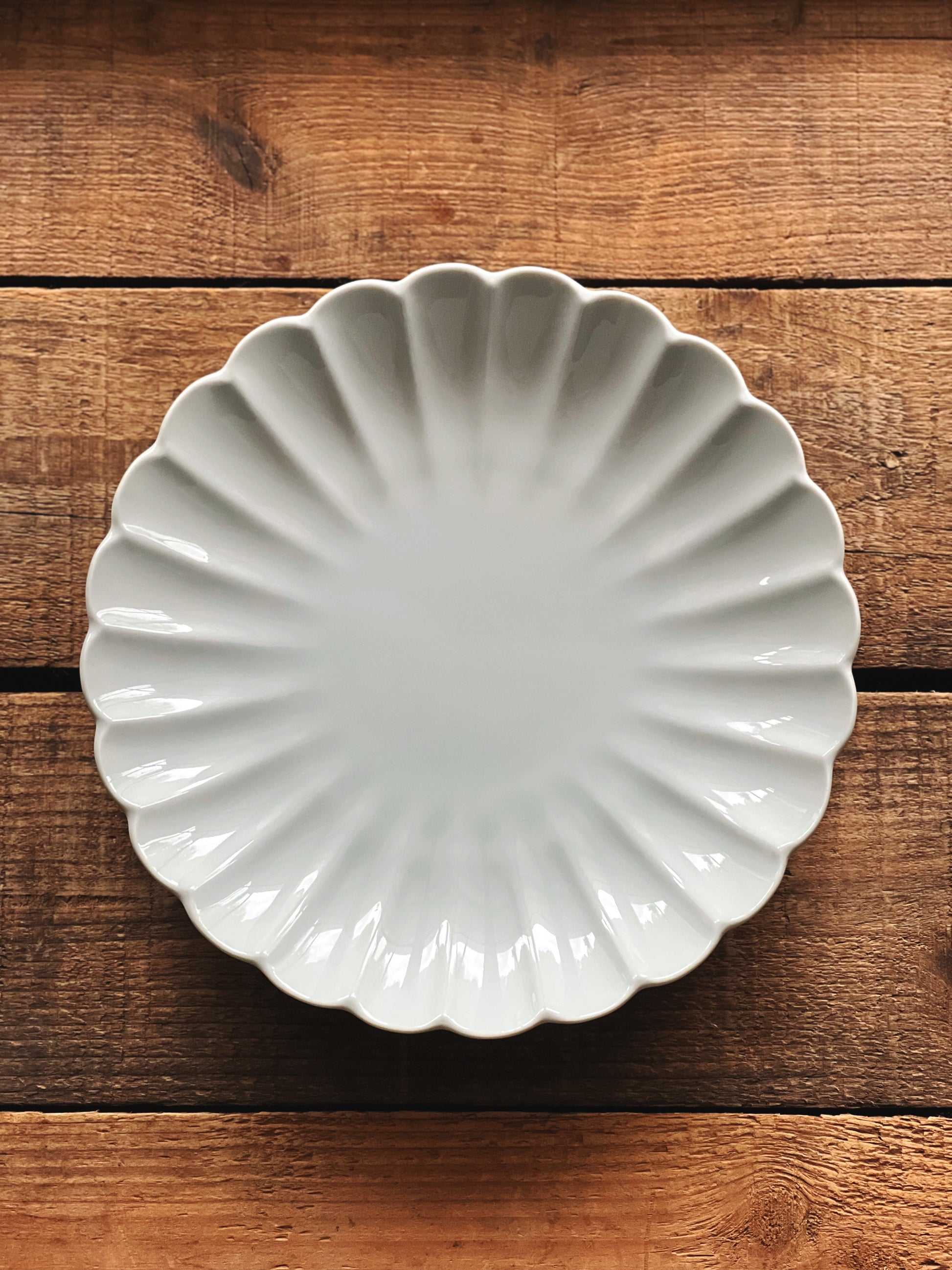 White scalloped salad plate from Neiman Marcus 
