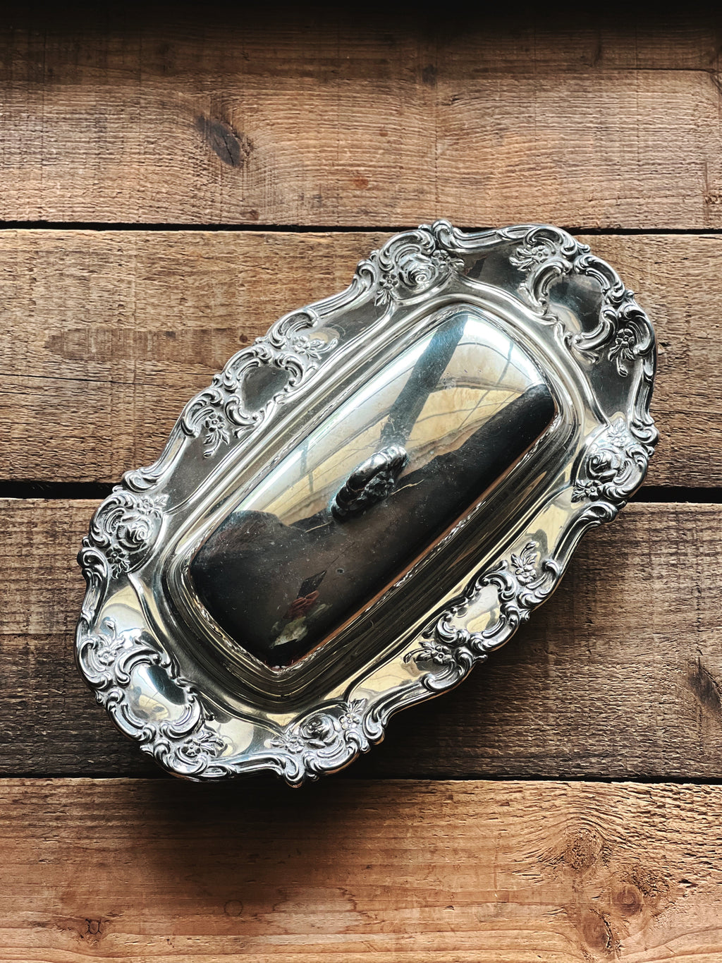 Elegant vintage silver serveware with floral border and ornate detailing