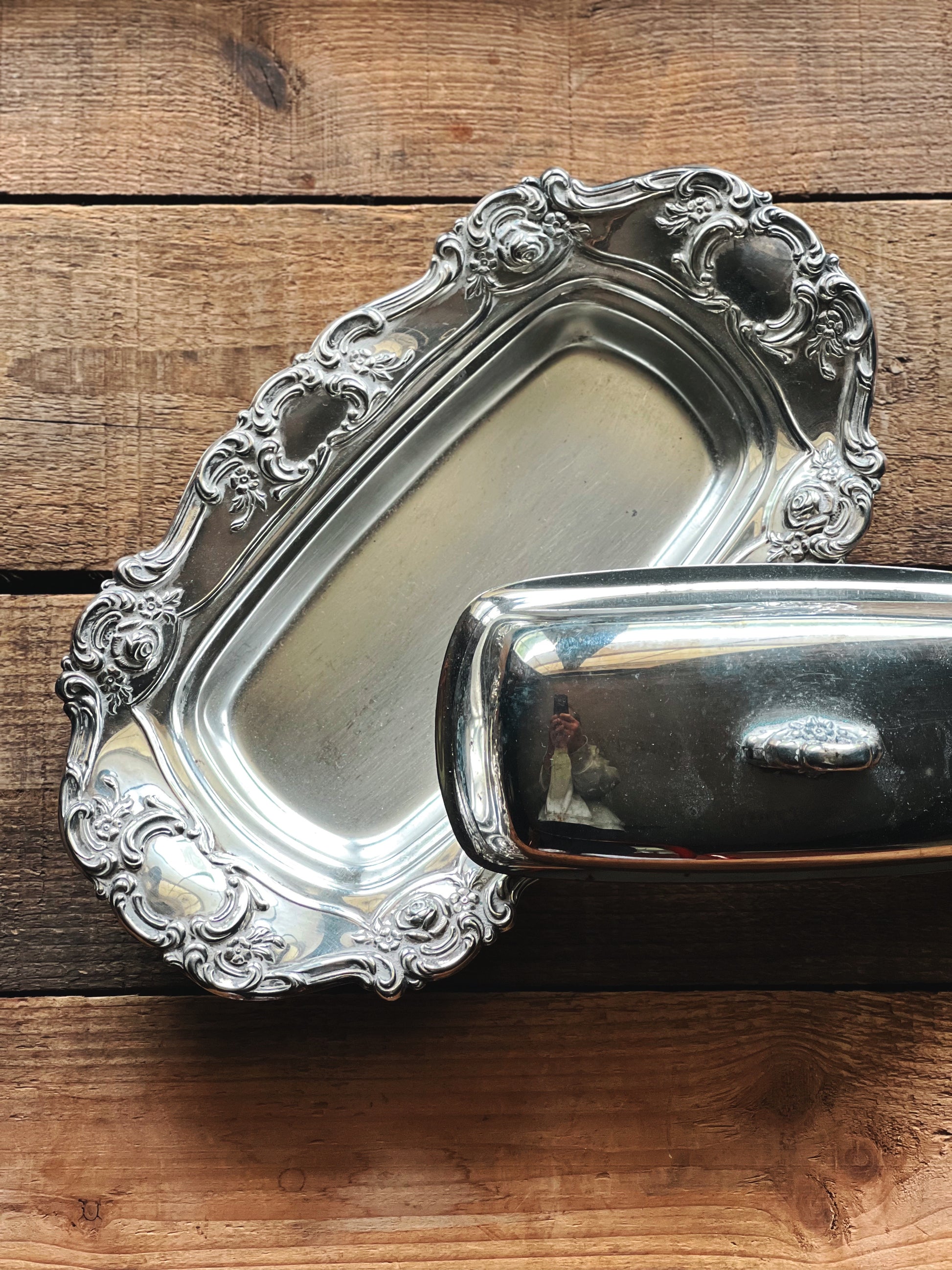 Towle Old Master silver butter dish with lid on rustic wood table