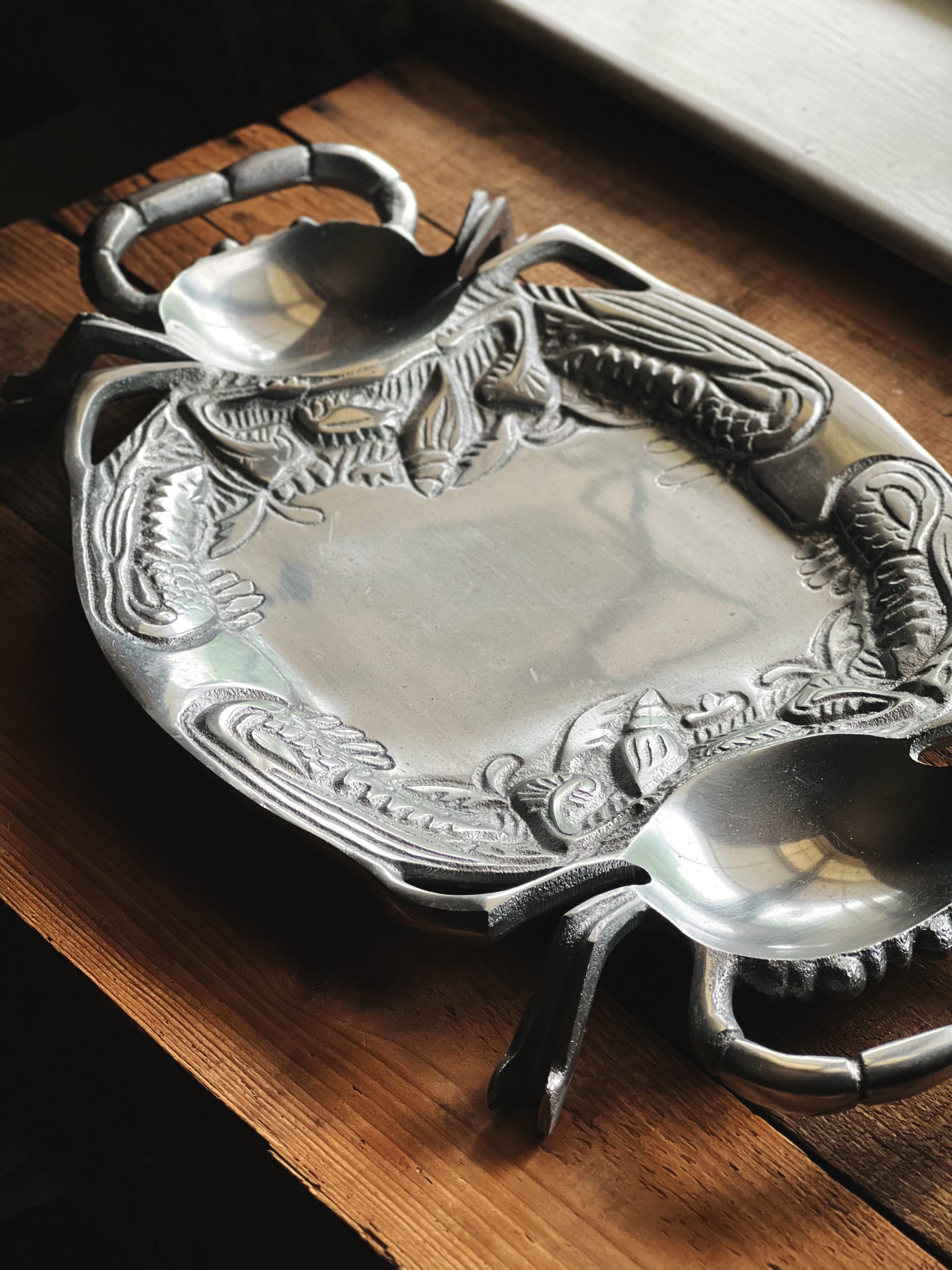 Vintage seaside entertaining tray with silver finish and footed base