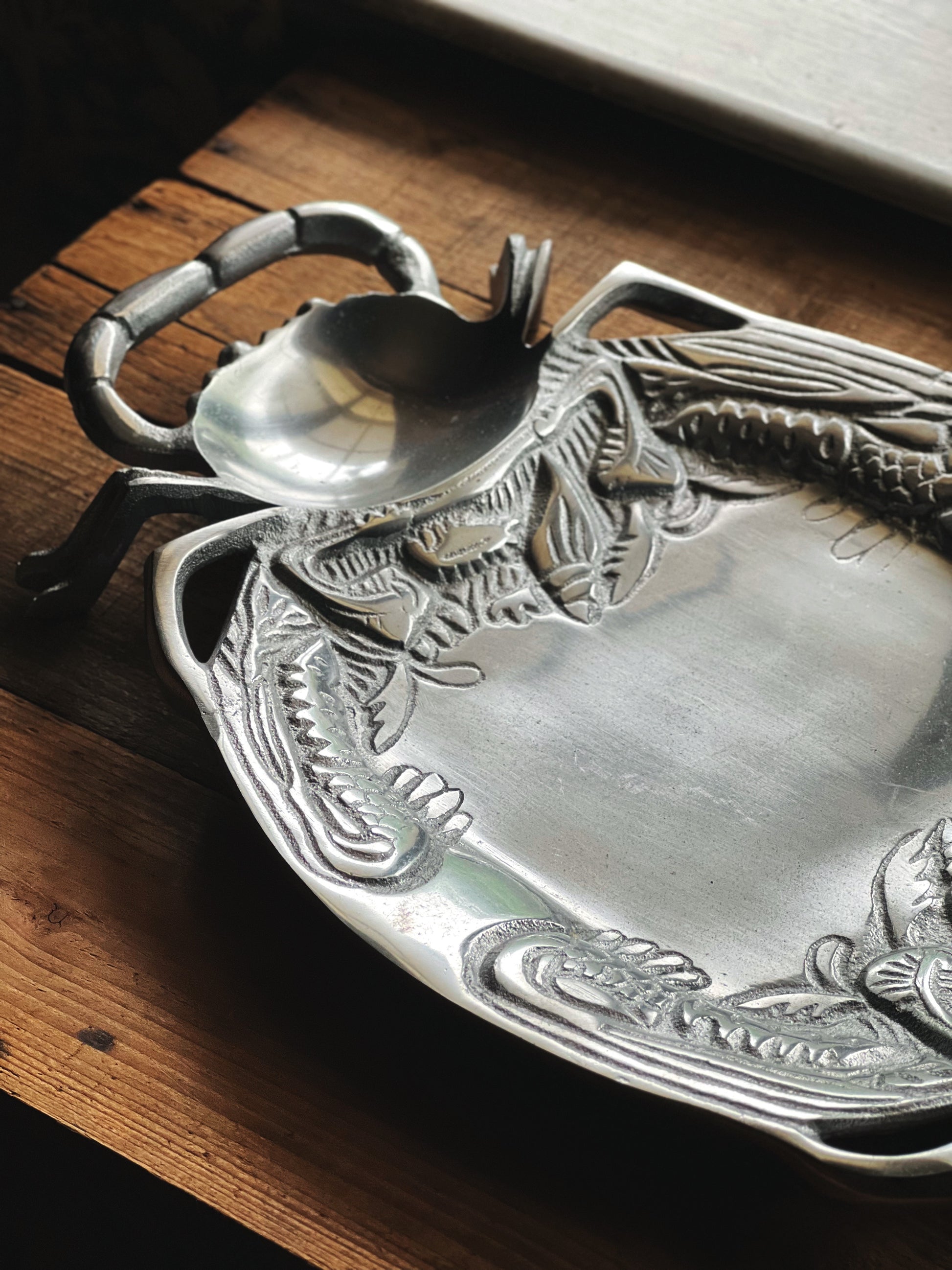 Vintage silver seafood serving tray with decorative crab details