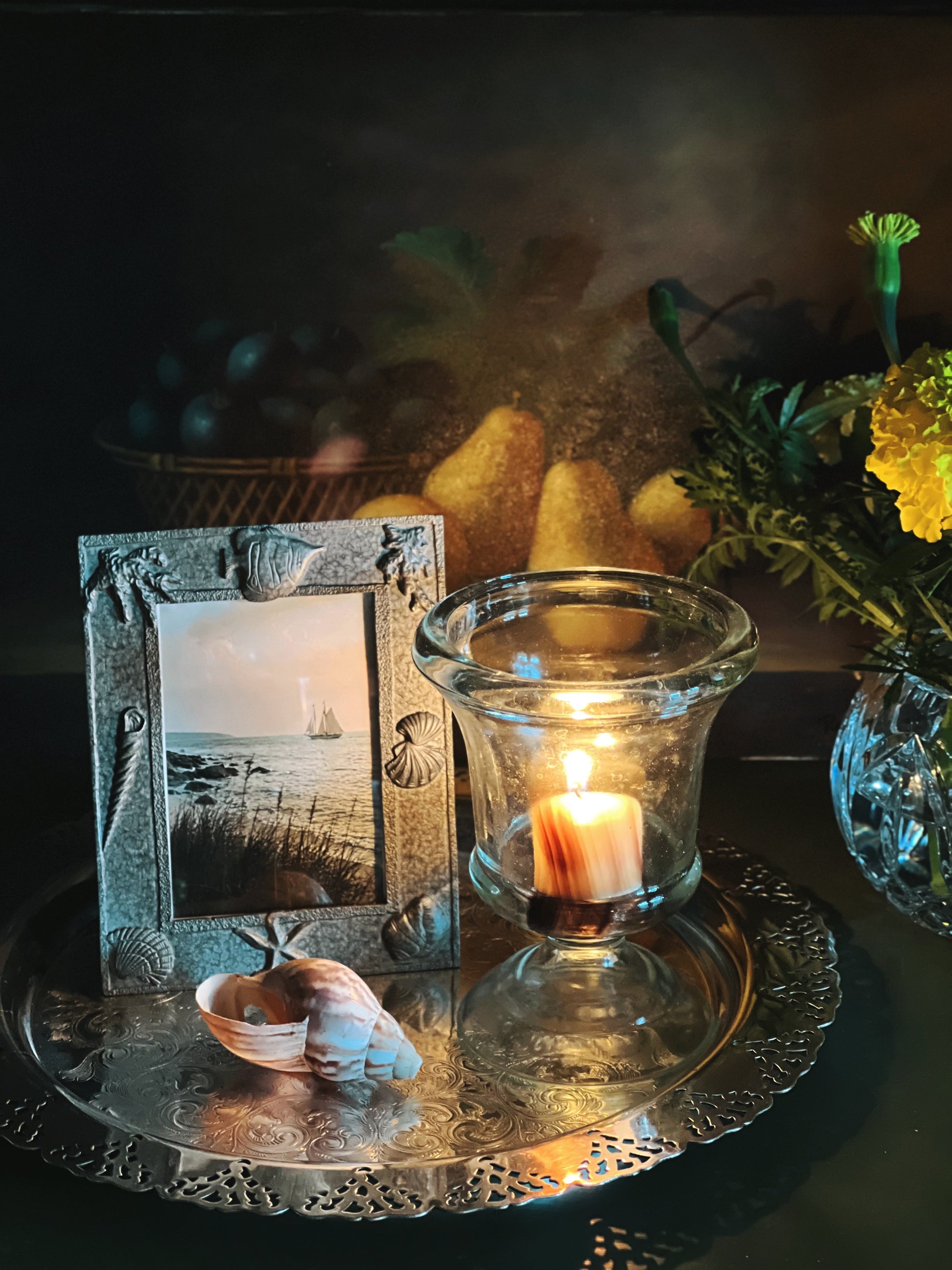 Thick textured vintage glass candle holder in moody lighting