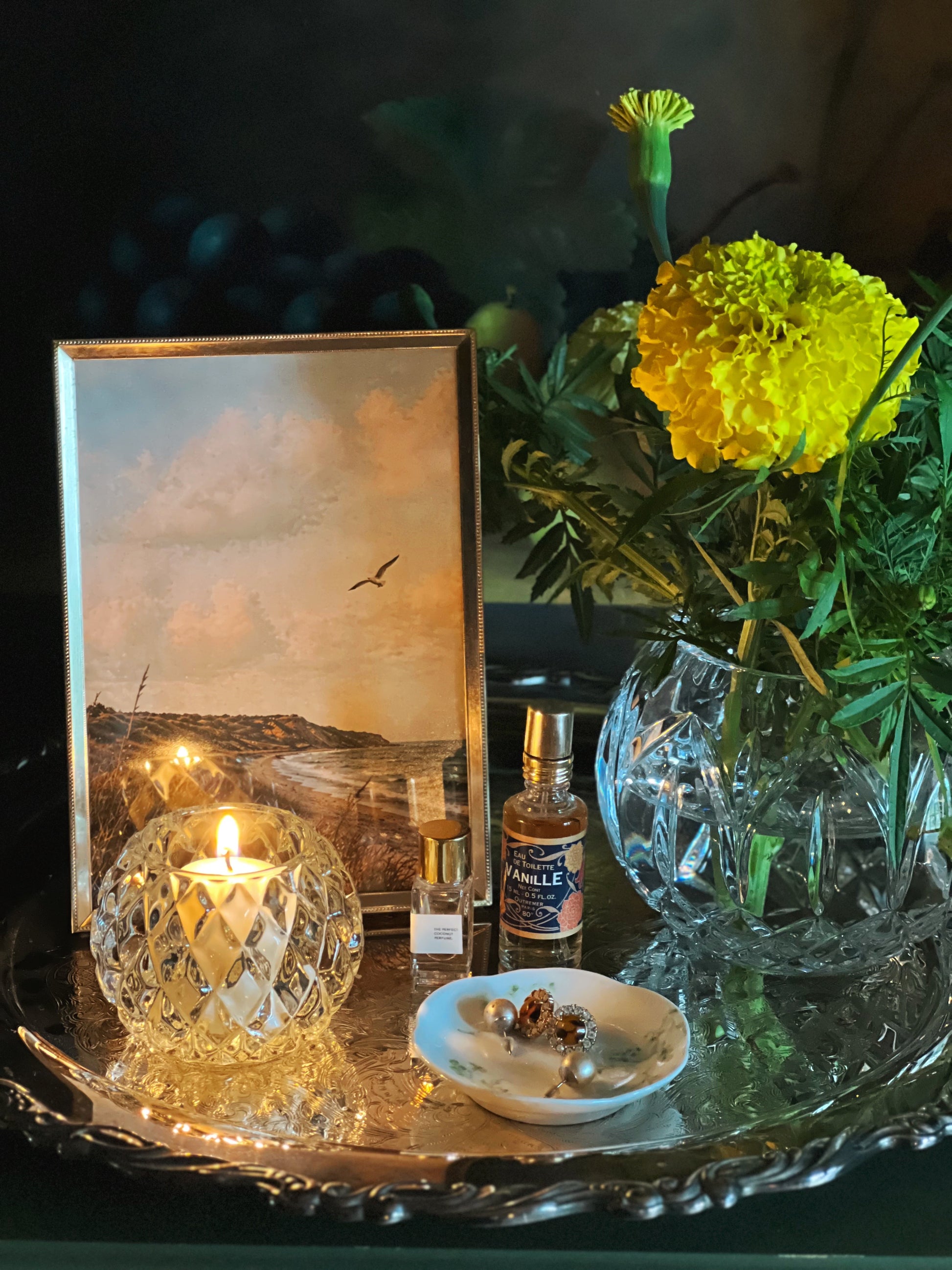 Wm Rogers silver serving tray with a frame, flowers and a votive candle