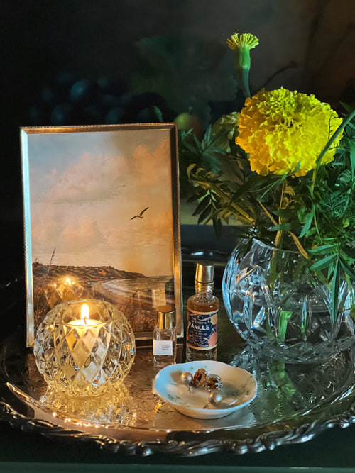 Wm Rogers silver serving tray with a frame, flowers and a votive candle