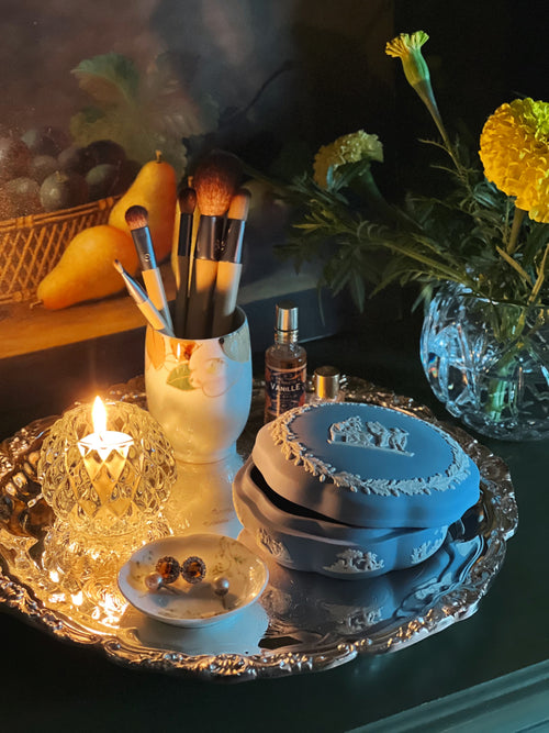 Vintage Oneida silverplate tray styled with candlelight and brushes