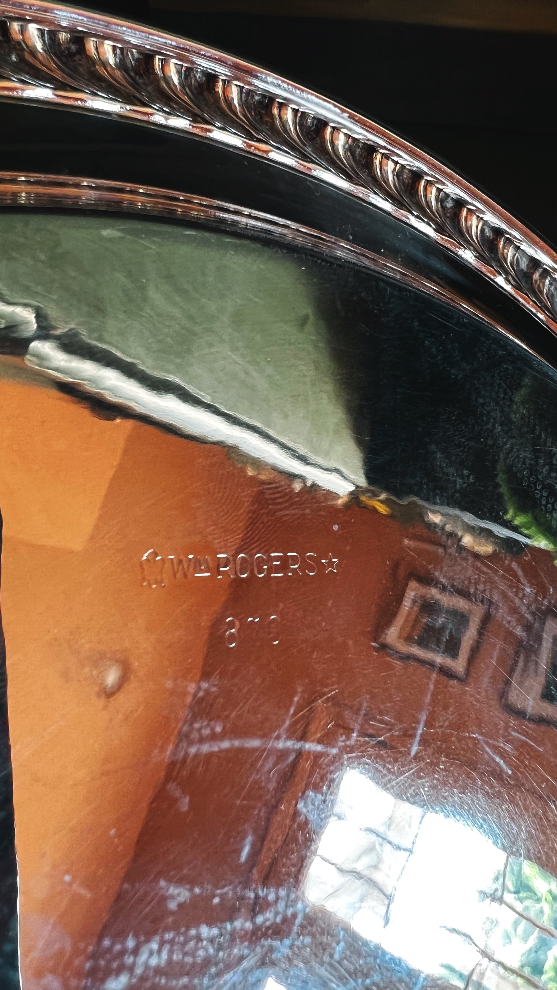 Close-up of a silver tray with Wm Rogers branding