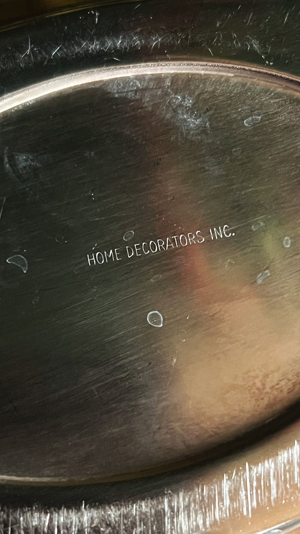 Silver tray with 'Home Decorators Inc.' engraving