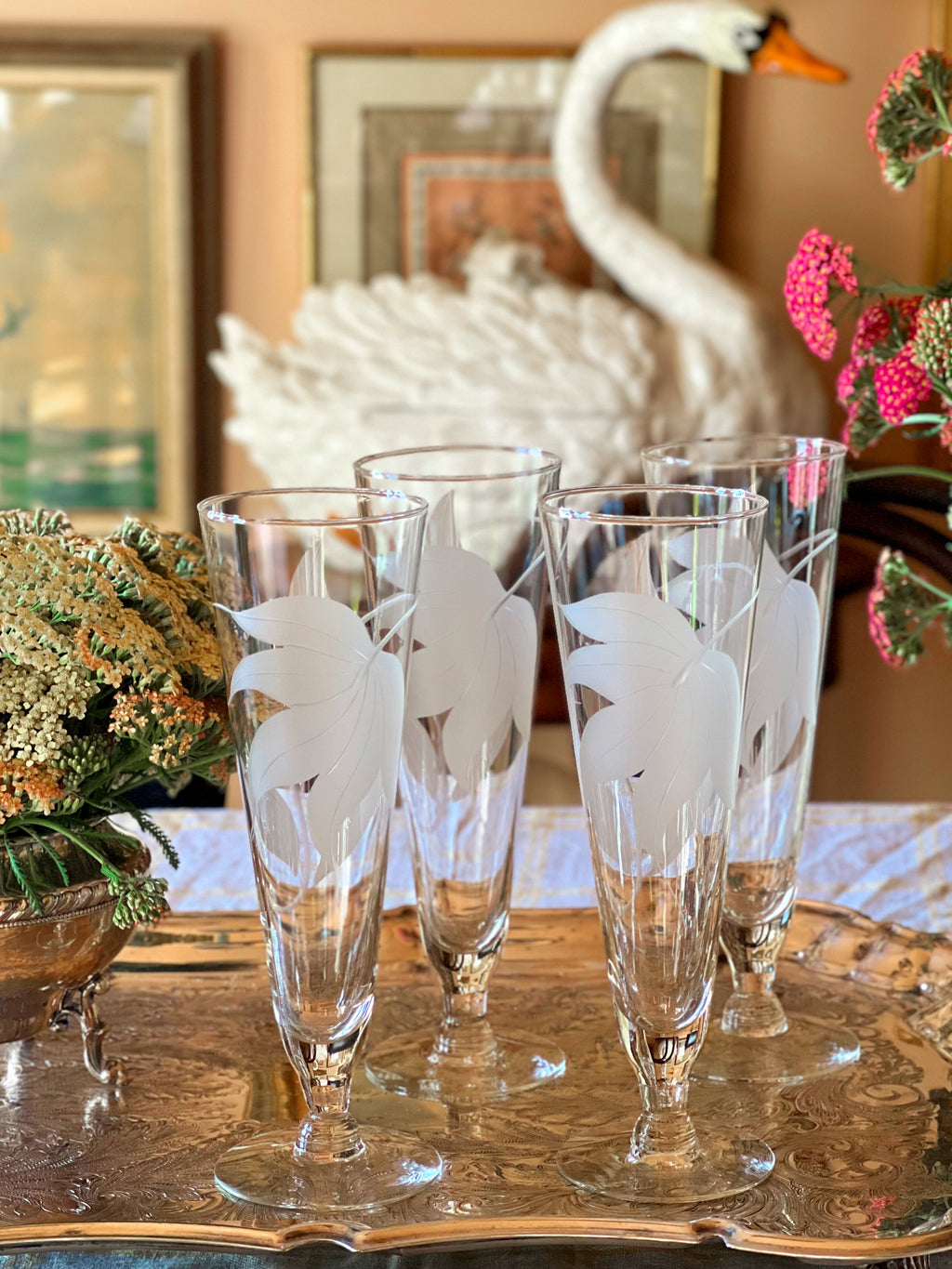 Vintage frosted floral champagne glasses with clear stems and bases.