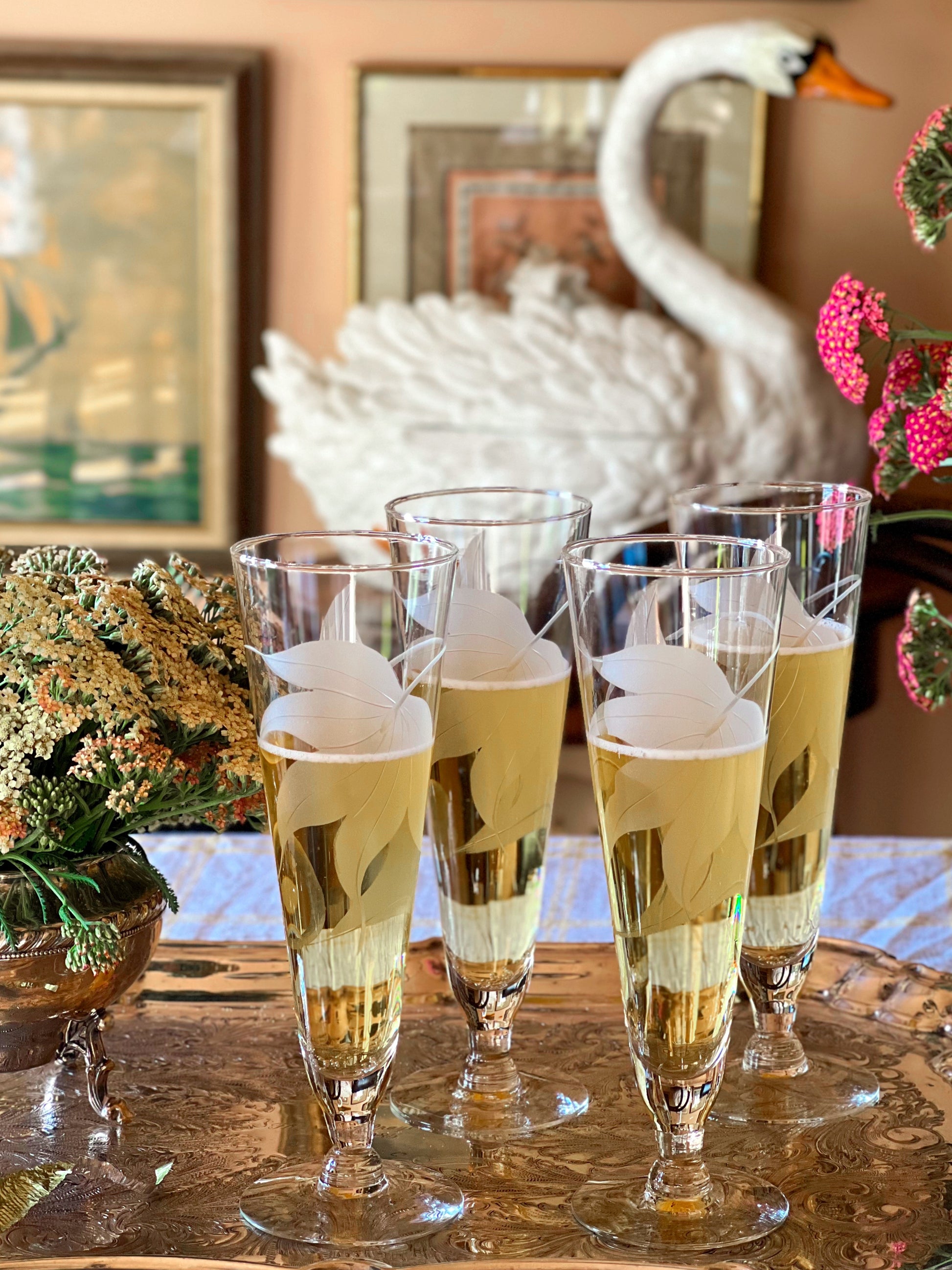 Grouping of vintage champagne flutes perfect for mimosas and celebrations.