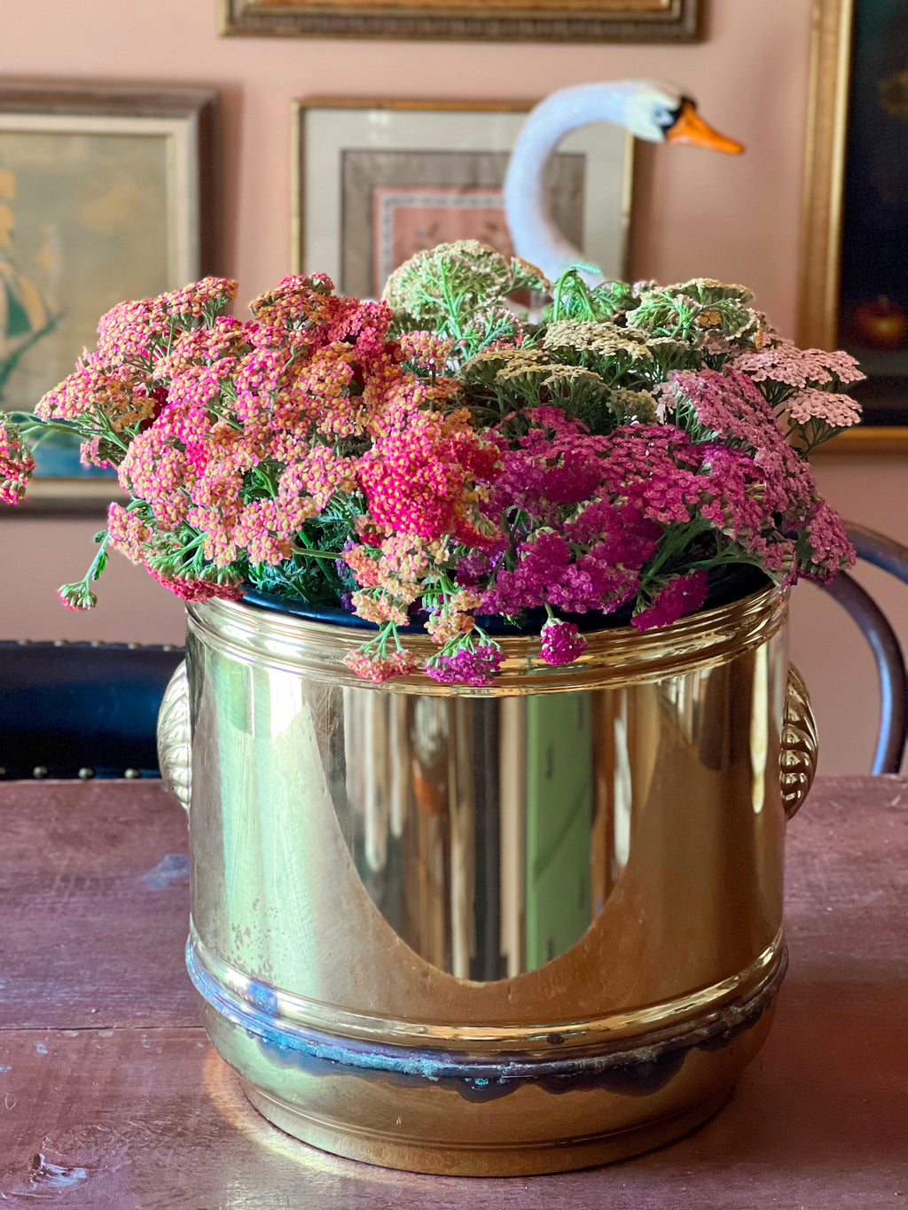Gold-toned vintage planter made in England with decorative shell-shaped handles.