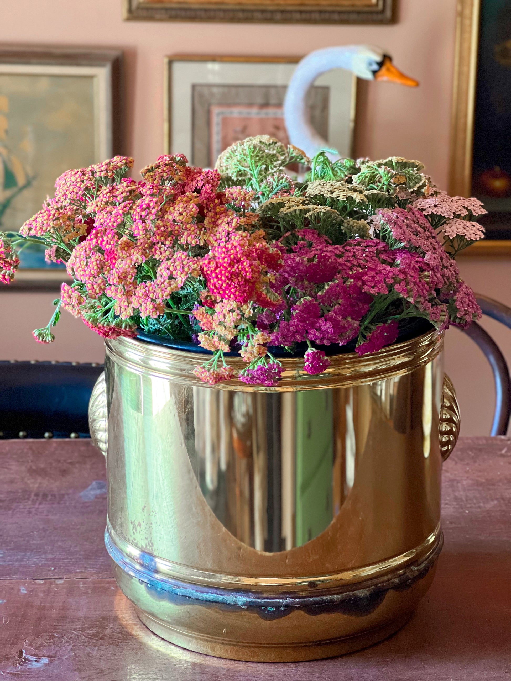 Gold-toned vintage planter made in England with decorative shell-shaped handles.