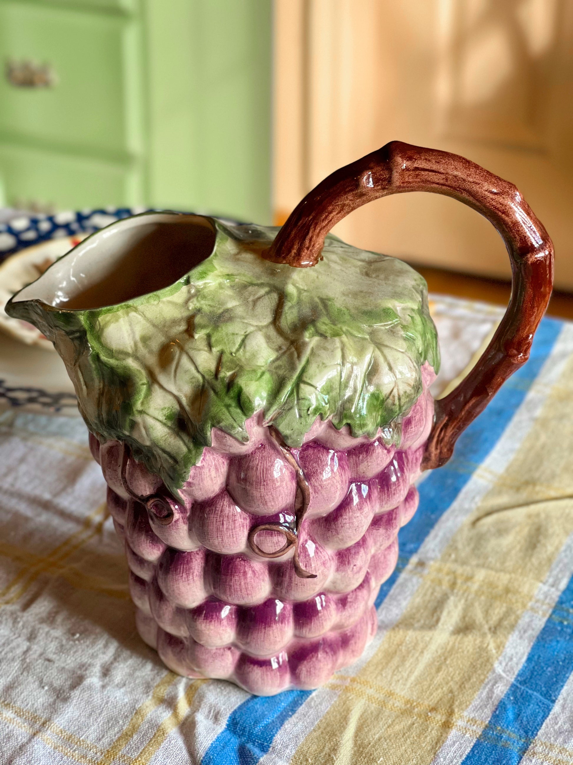 Majolica pitcher with a grape design 