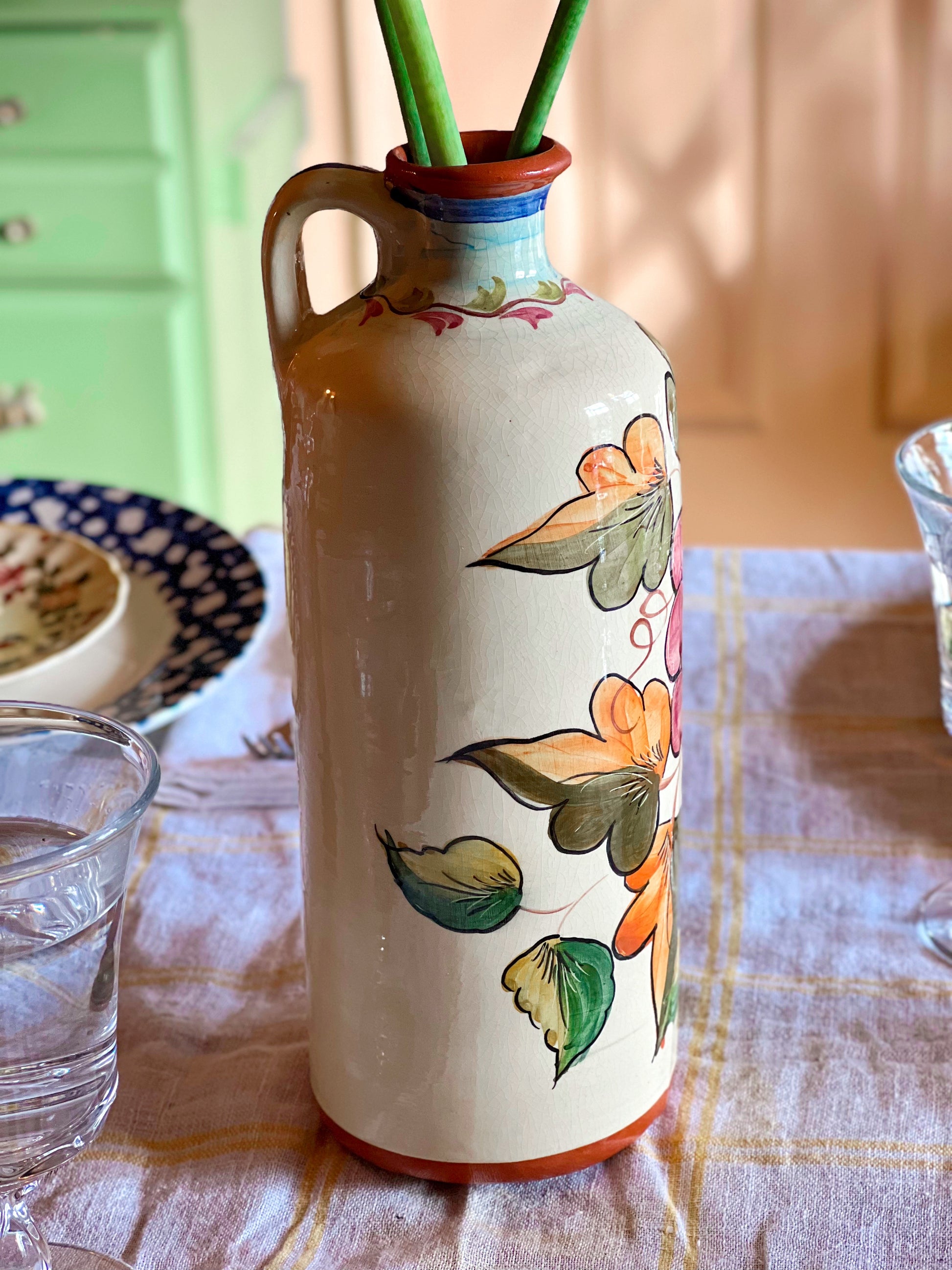 Decorative ceramic vase with floral patterns on a table