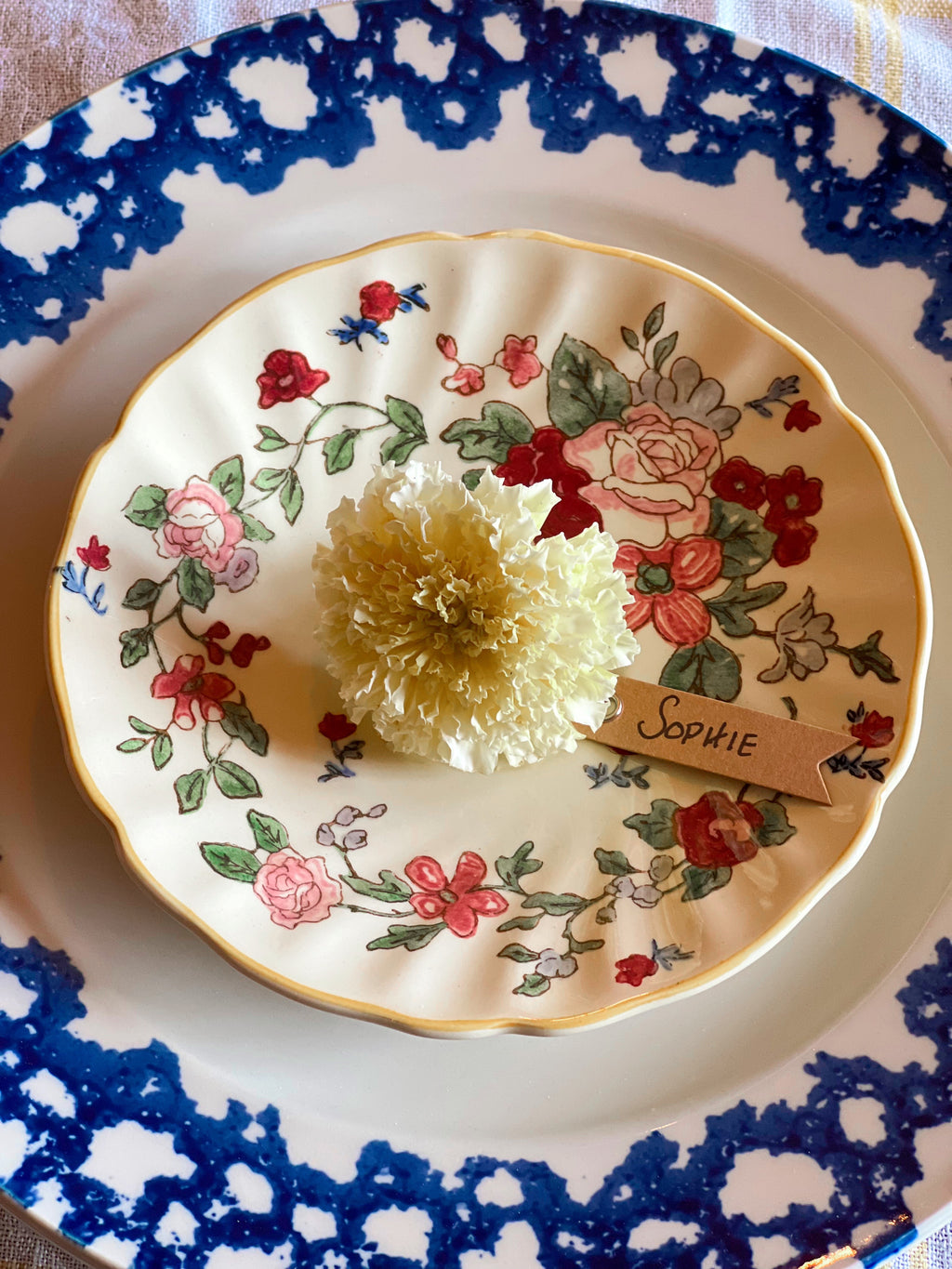 Decorative plate with floral patterns and a white flower labeled 'Sophie'
