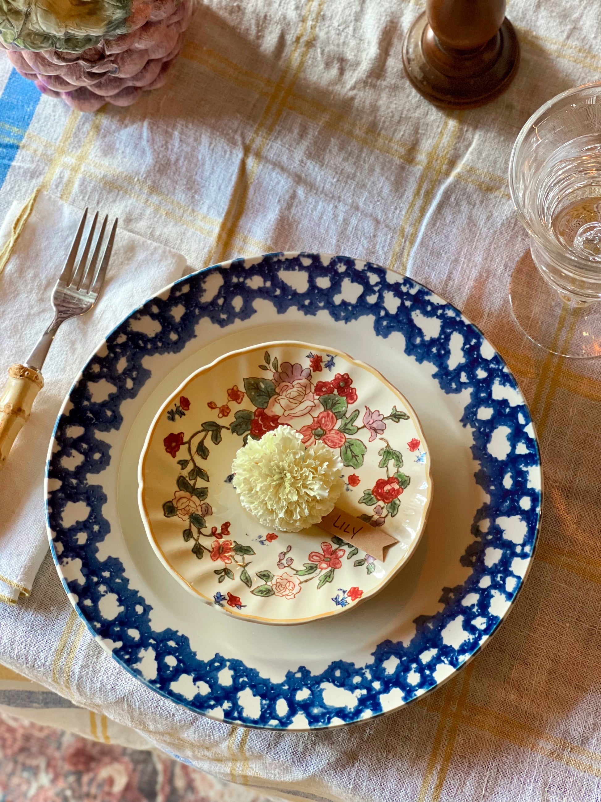 Navy blue spongeware plate with floral design on a table setting