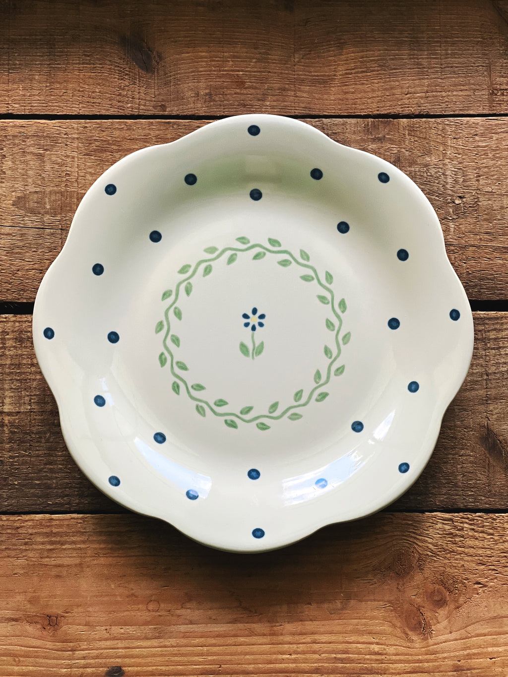 Set of four vintage Pfaltzgraff Cloverhill floral salad plates with scalloped edges and blue and green accents.