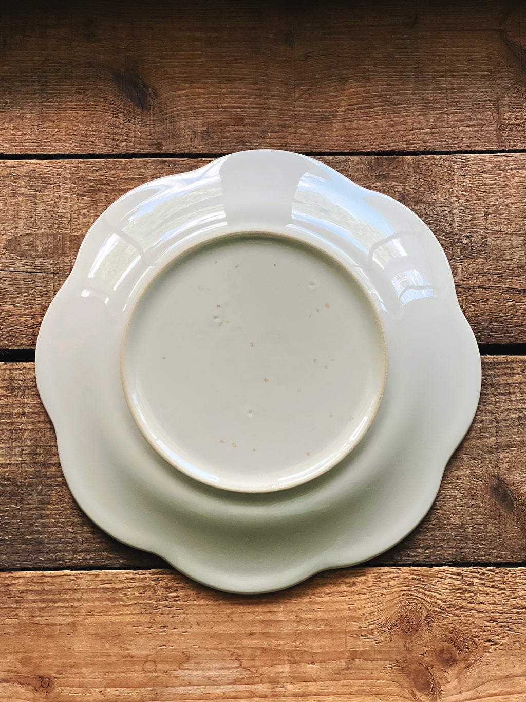 Underside of a vintage Pfaltzgraff Cloverhill floral salad plate.
