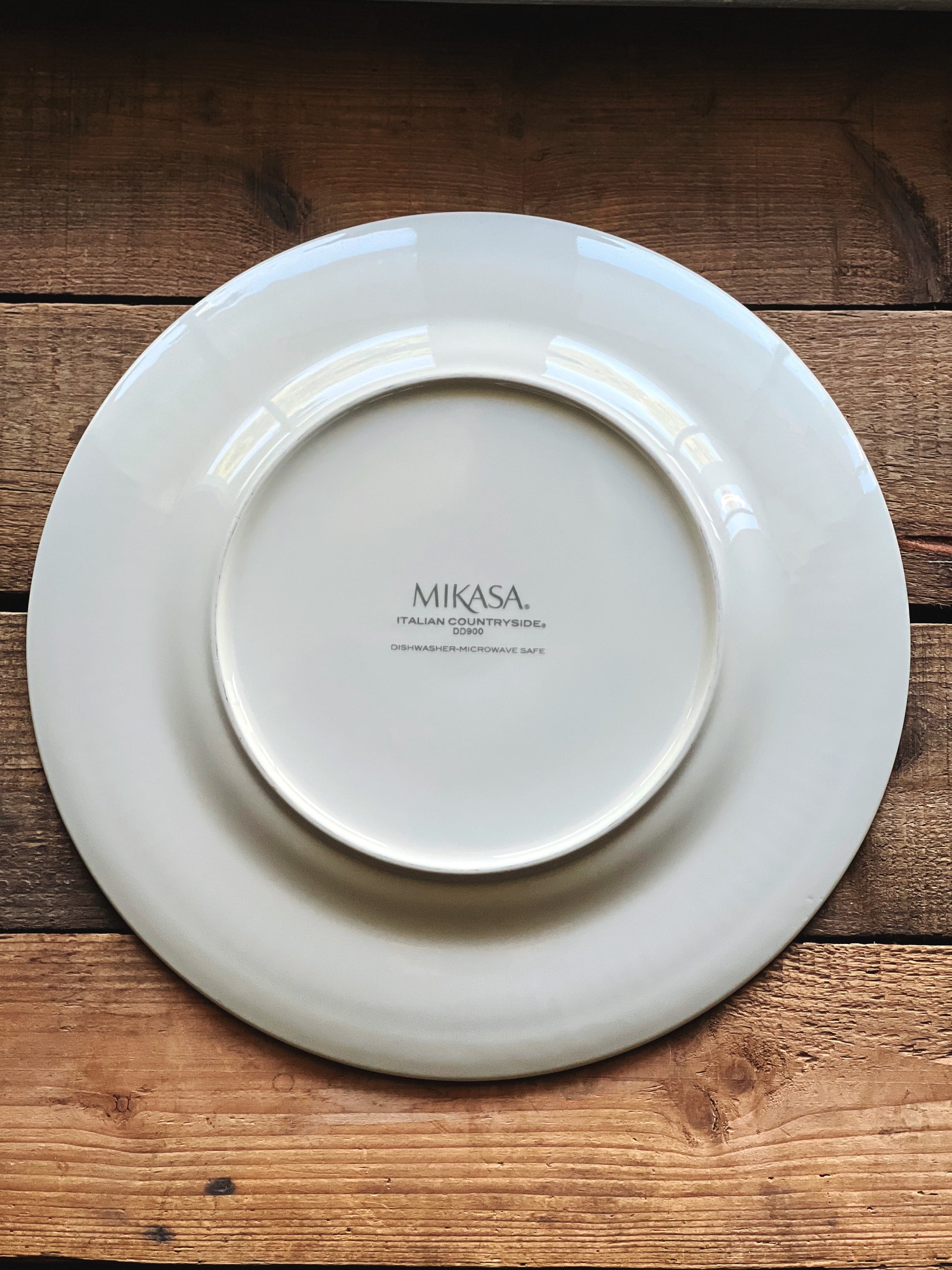 White Mikasa plate on a wooden surface