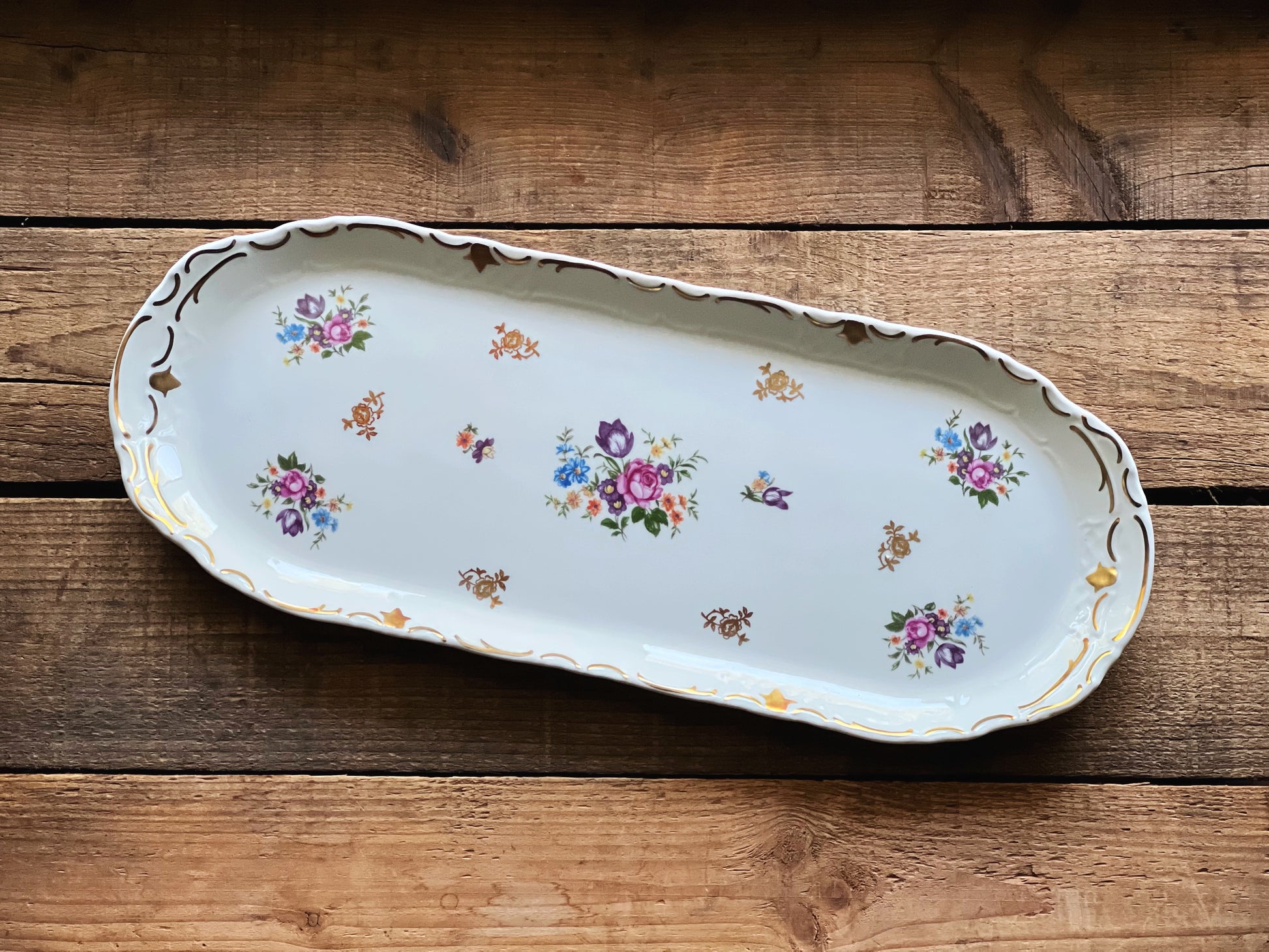 Reichenbach German Democratic Republic  tray with floral patterns on a wooden surface