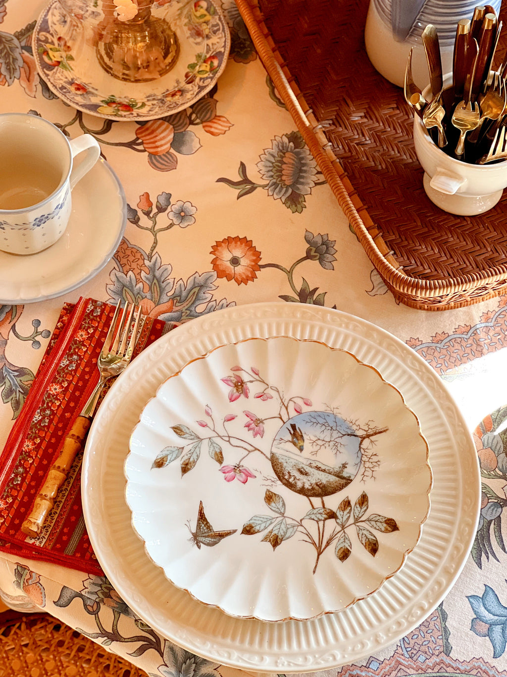 Vintage scalloped bird and floralsalad plate on a table setting 