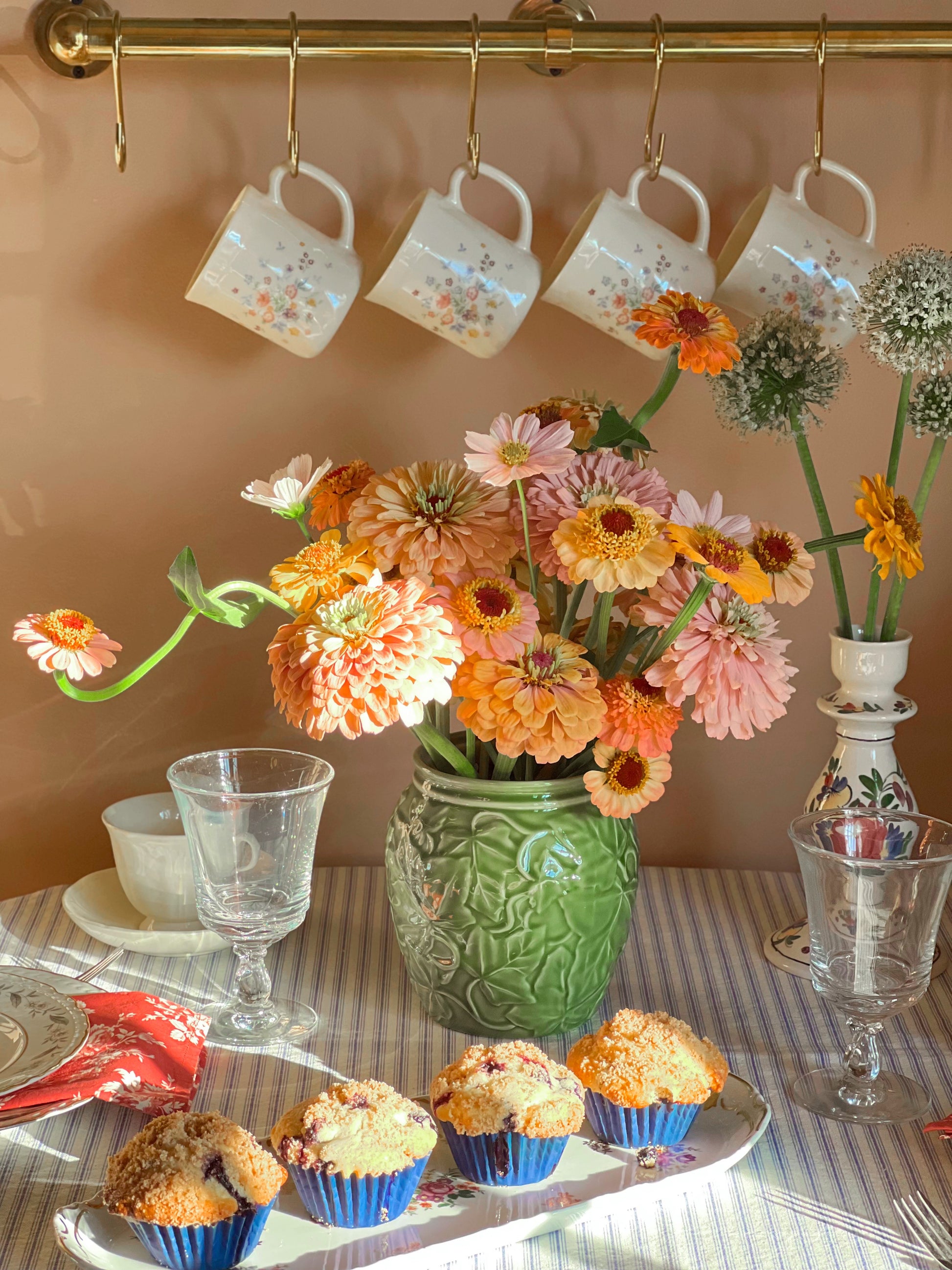 Franciscan Ivy II kitchen canister full of flowers on a breakfast table
